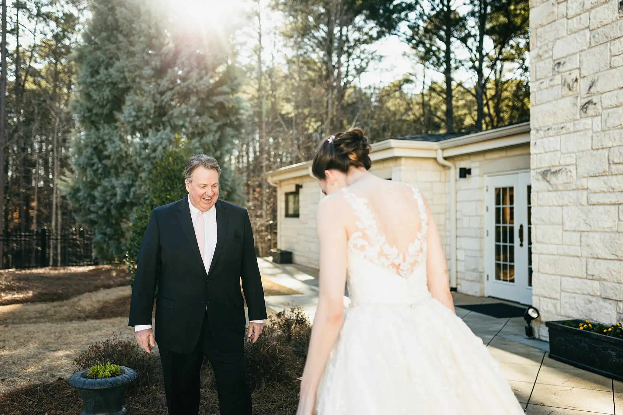 First Look: the bride's father turning to see her, before their wedding at Ashton Gardens Atlanta in Sugar Hill, GA