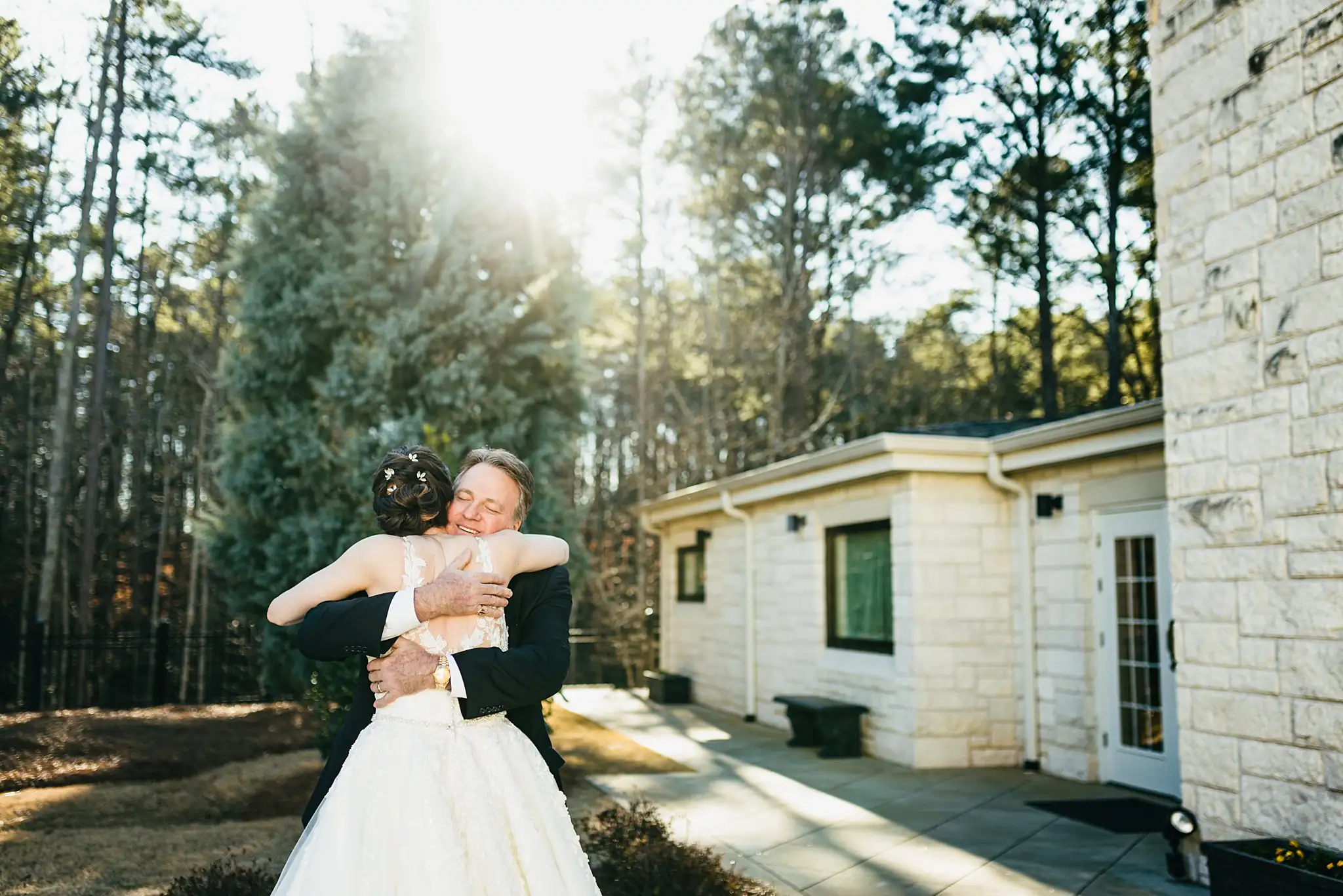 First Look: the bride and her father holding each other, before their wedding at Ashton Gardens Atlanta in Sugar Hill, GA