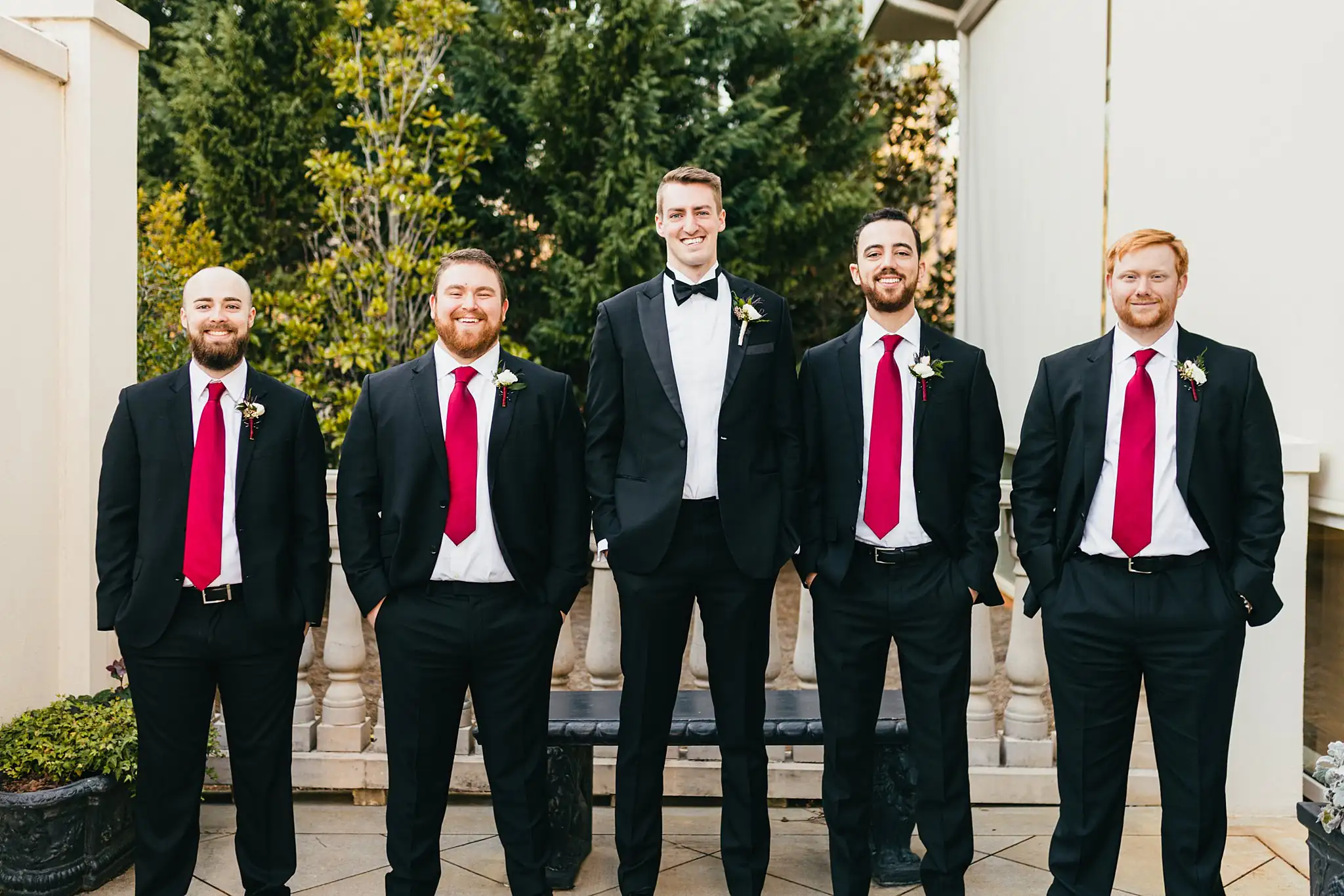 Wedding Party: the groomsmen in black tuxedos and red ties, at their wedding at Ashton Gardens Atlanta in Sugar Hill, GA