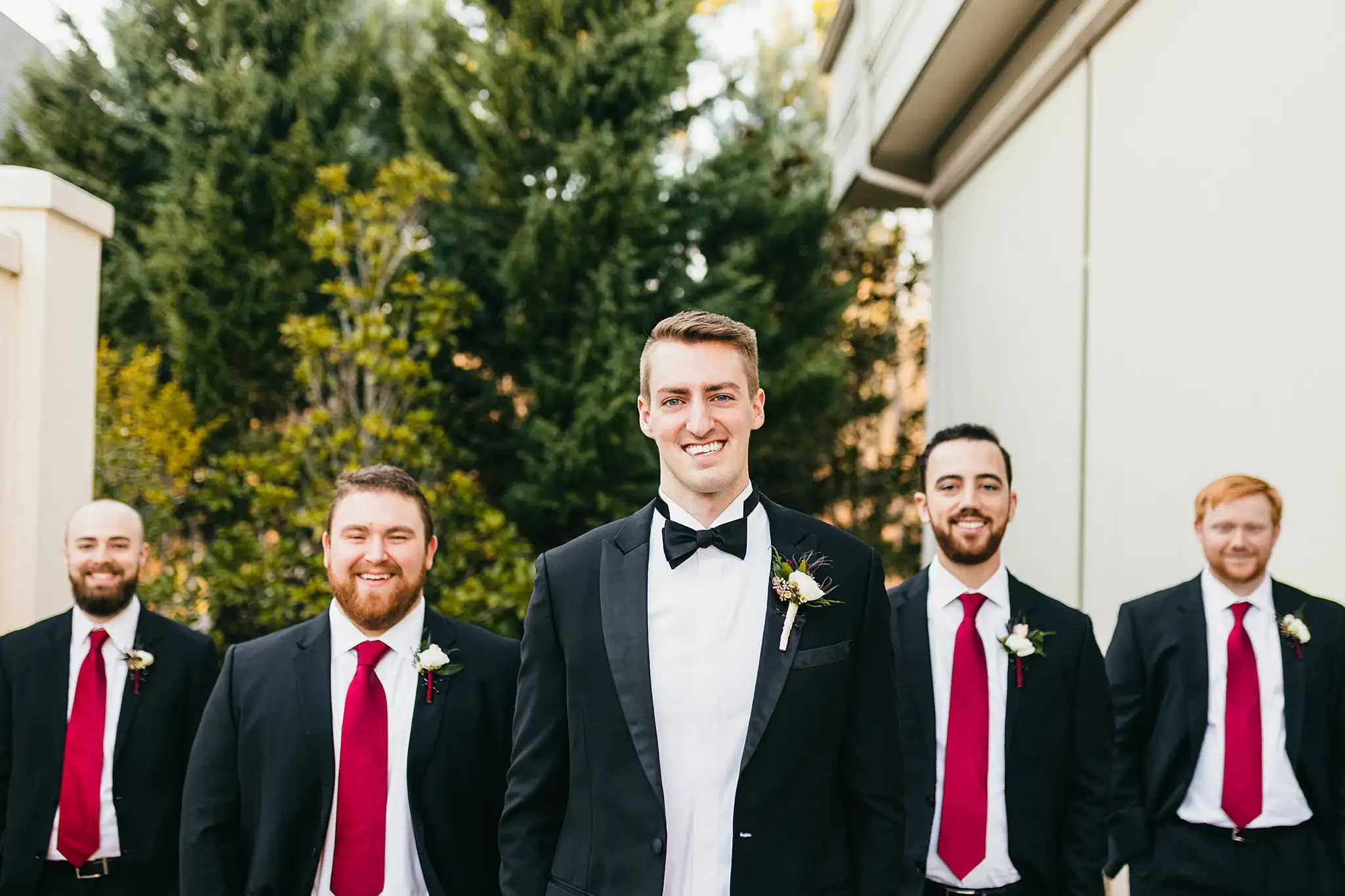 Wedding Party: the groom lined up with his groomsmen, at their wedding at Ashton Gardens Atlanta in Sugar Hill, GA