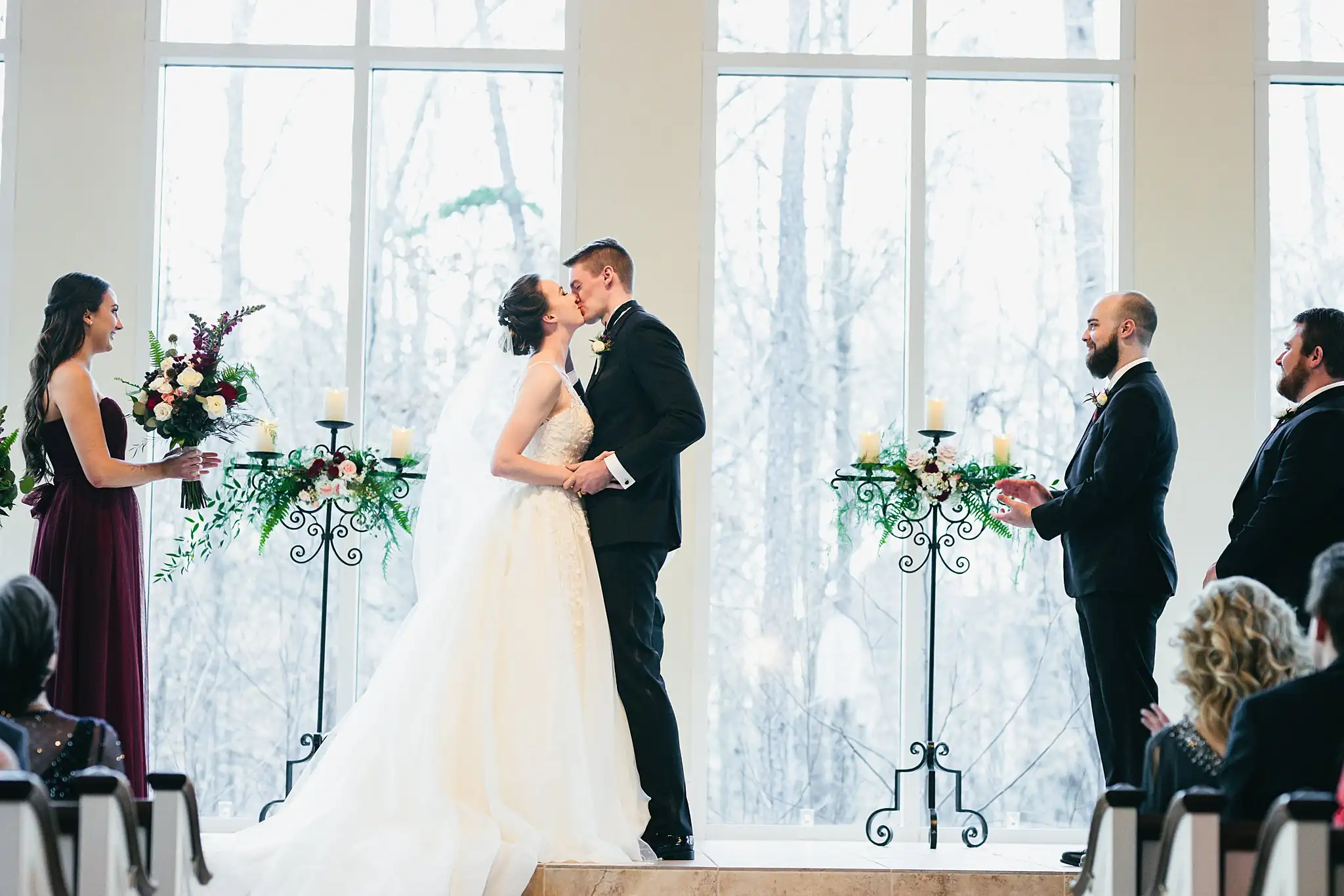 Wedding Ceremony: the first kiss at the altar, at their wedding at Ashton Gardens Atlanta in Sugar Hill, GA