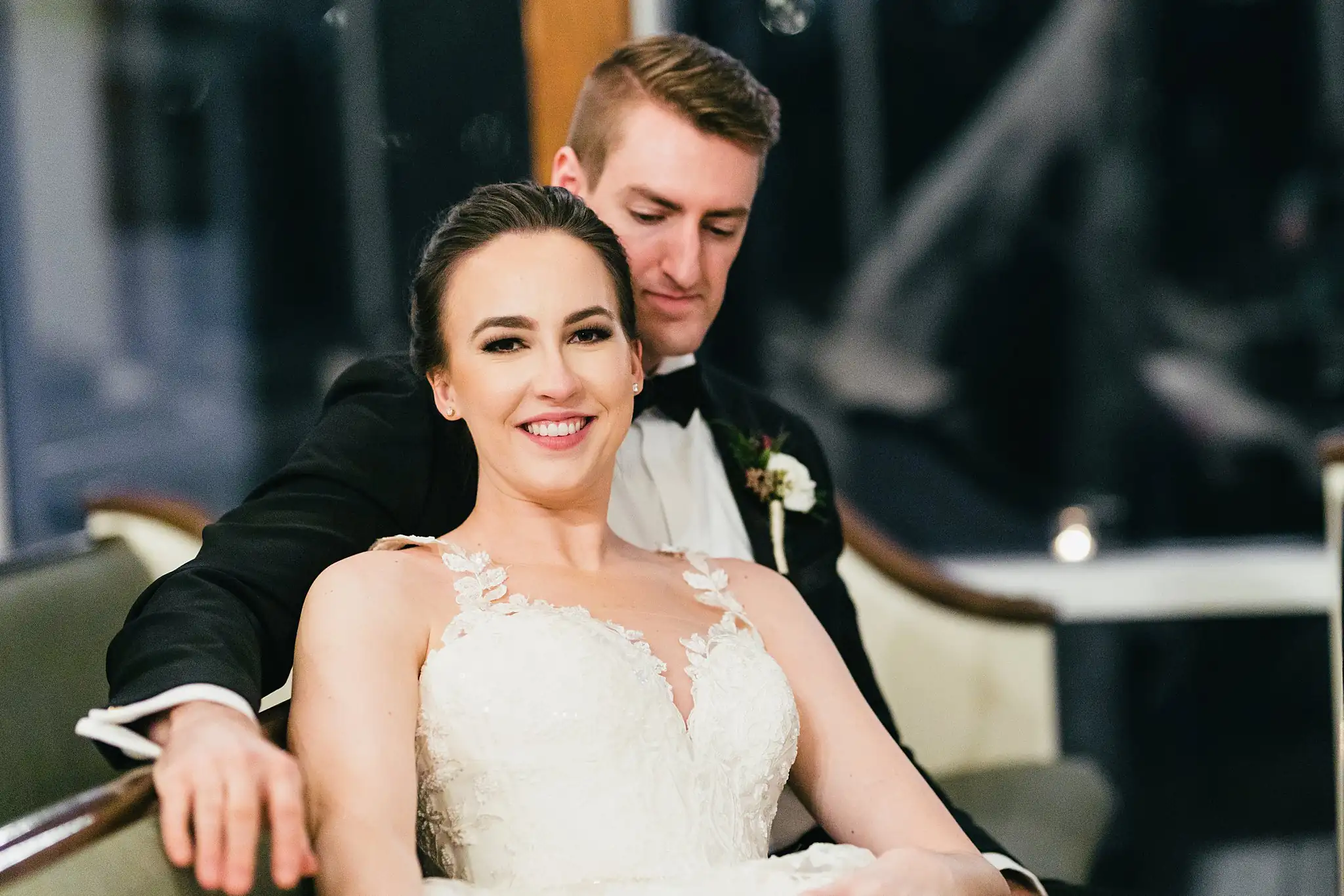 Wedding Formals: the couple seated together in the pews, at their wedding at Ashton Gardens Atlanta in Sugar Hill, GA