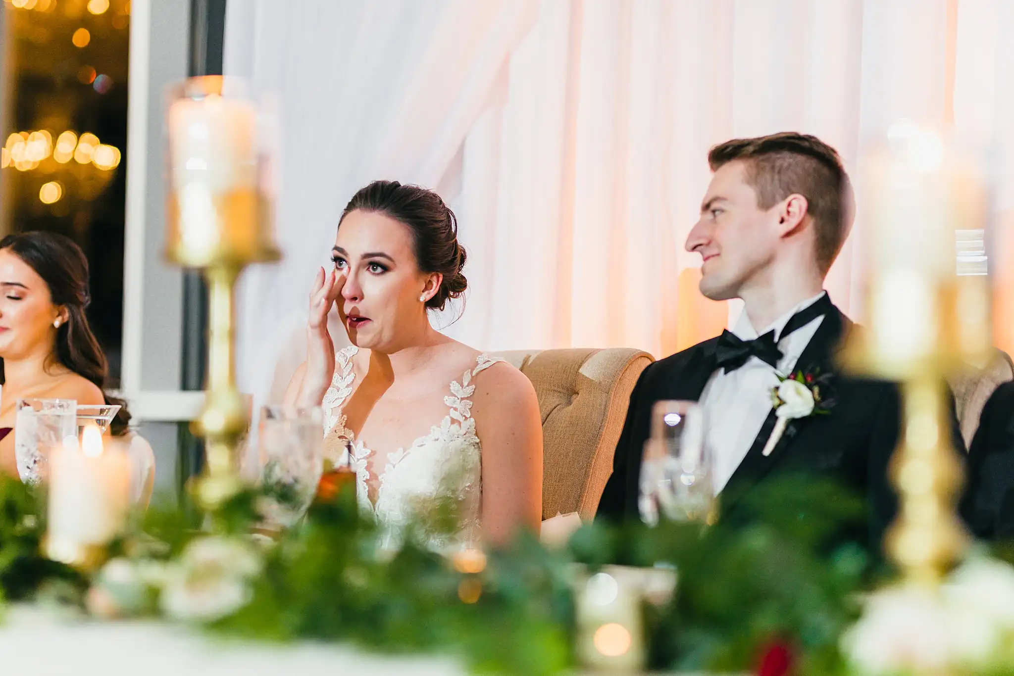 Wedding Reception: the bride wiping a tear during a toast, at their wedding at Ashton Gardens Atlanta in Sugar Hill, GA