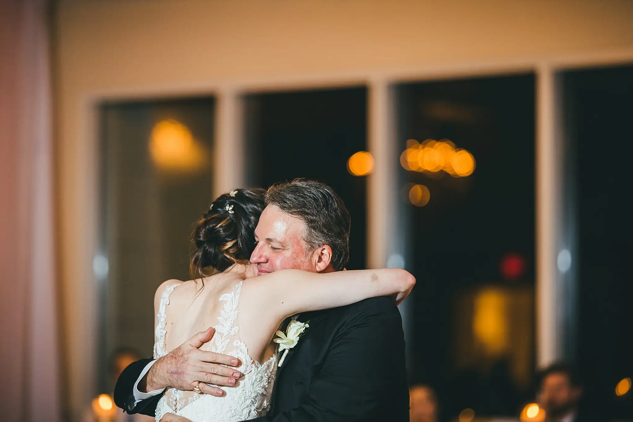 Parent Dance: the bride holding her father as they dance, at their wedding at Ashton Gardens Atlanta in Sugar Hill, GA