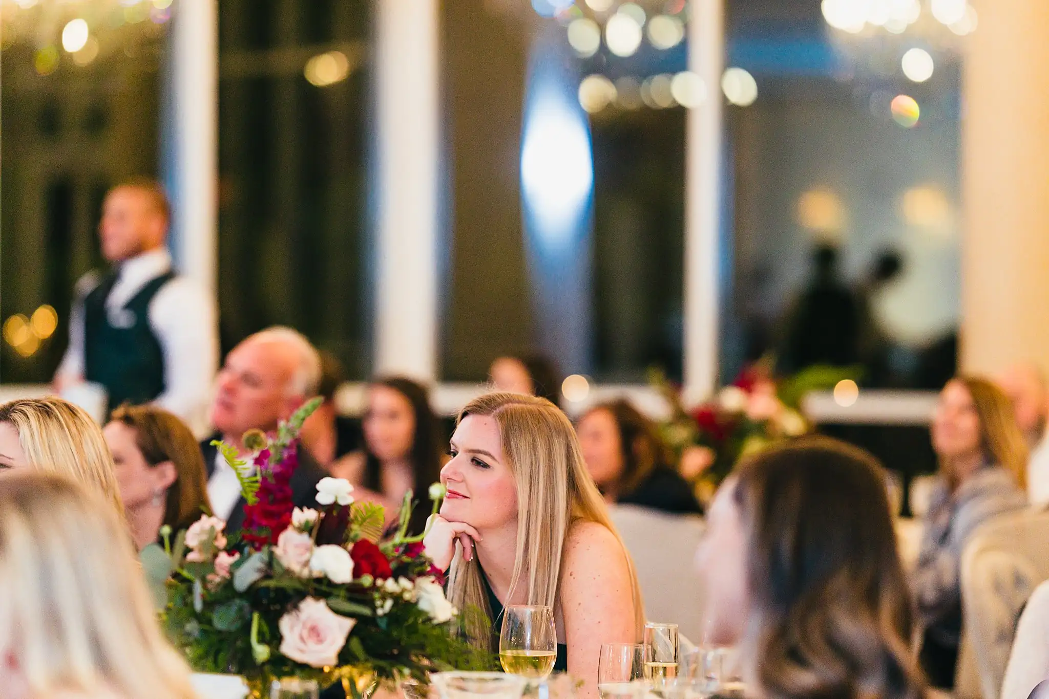 Wedding Reception: guests listening from their table, at their wedding at Ashton Gardens Atlanta in Sugar Hill, GA