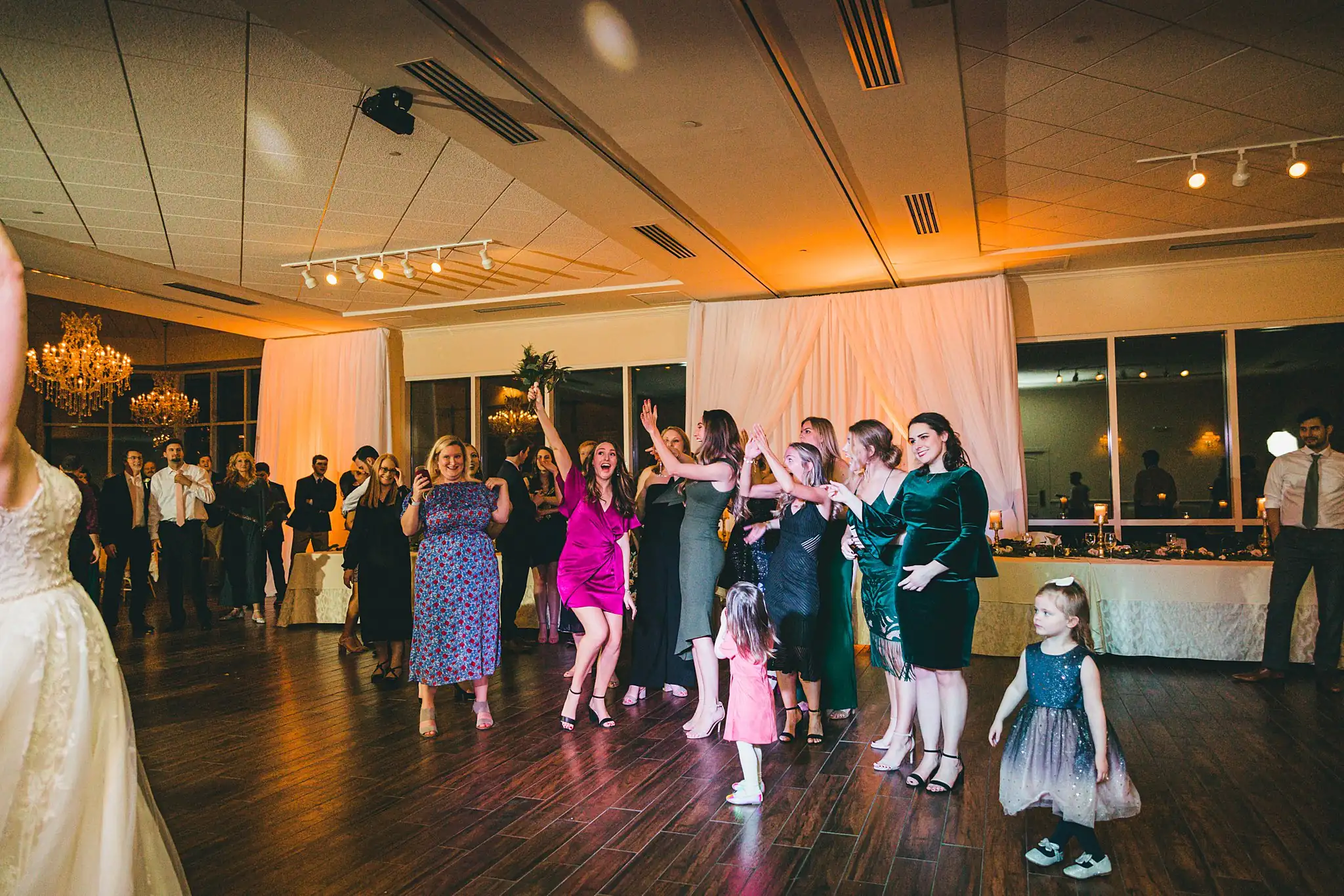 Wedding Reception: guests and flower girls on the dance floor, at their wedding at Ashton Gardens Atlanta in Sugar Hill, GA