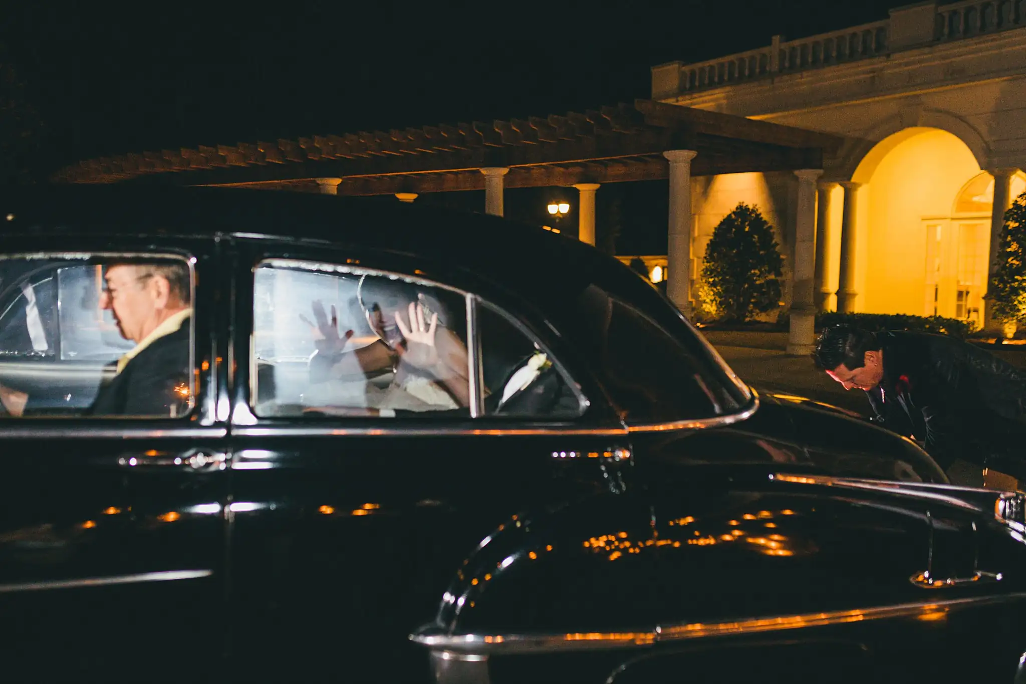 Send-Off: the couple waving from the vintage getaway car, at their wedding at Ashton Gardens Atlanta in Sugar Hill, GA