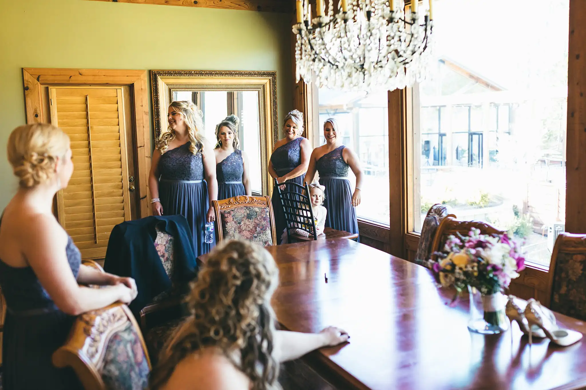 AtlantaWeddingPhotographers_1417.jpg Getting Ready: the bridesmaids waiting in the dining room, before their wedding at Three Birches in Alpharetta, GA