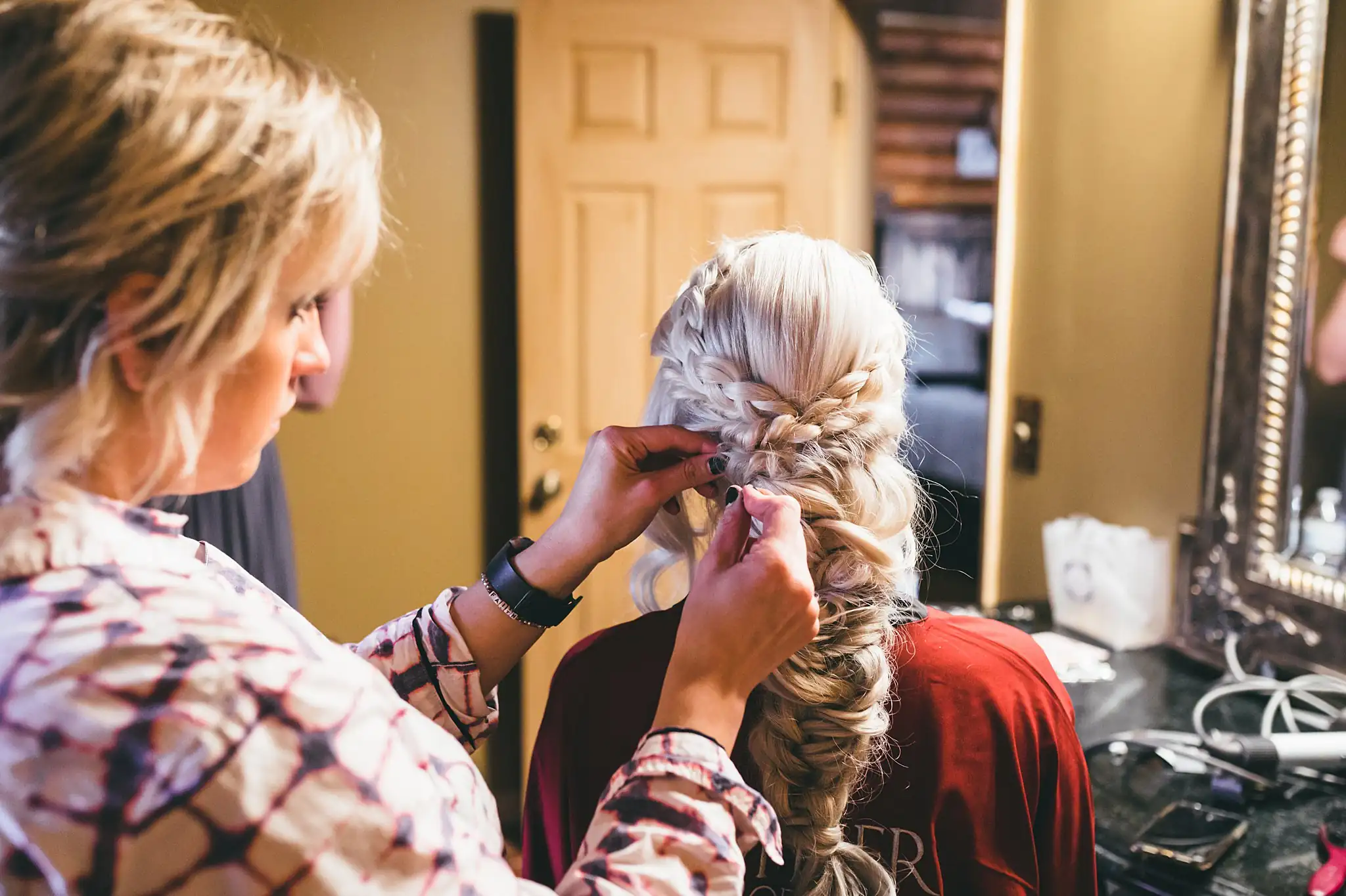 AtlantaWeddingPhotographers_1418.jpg Getting Ready: the bride's braid being finished, before their wedding at Three Birches in Alpharetta, GA