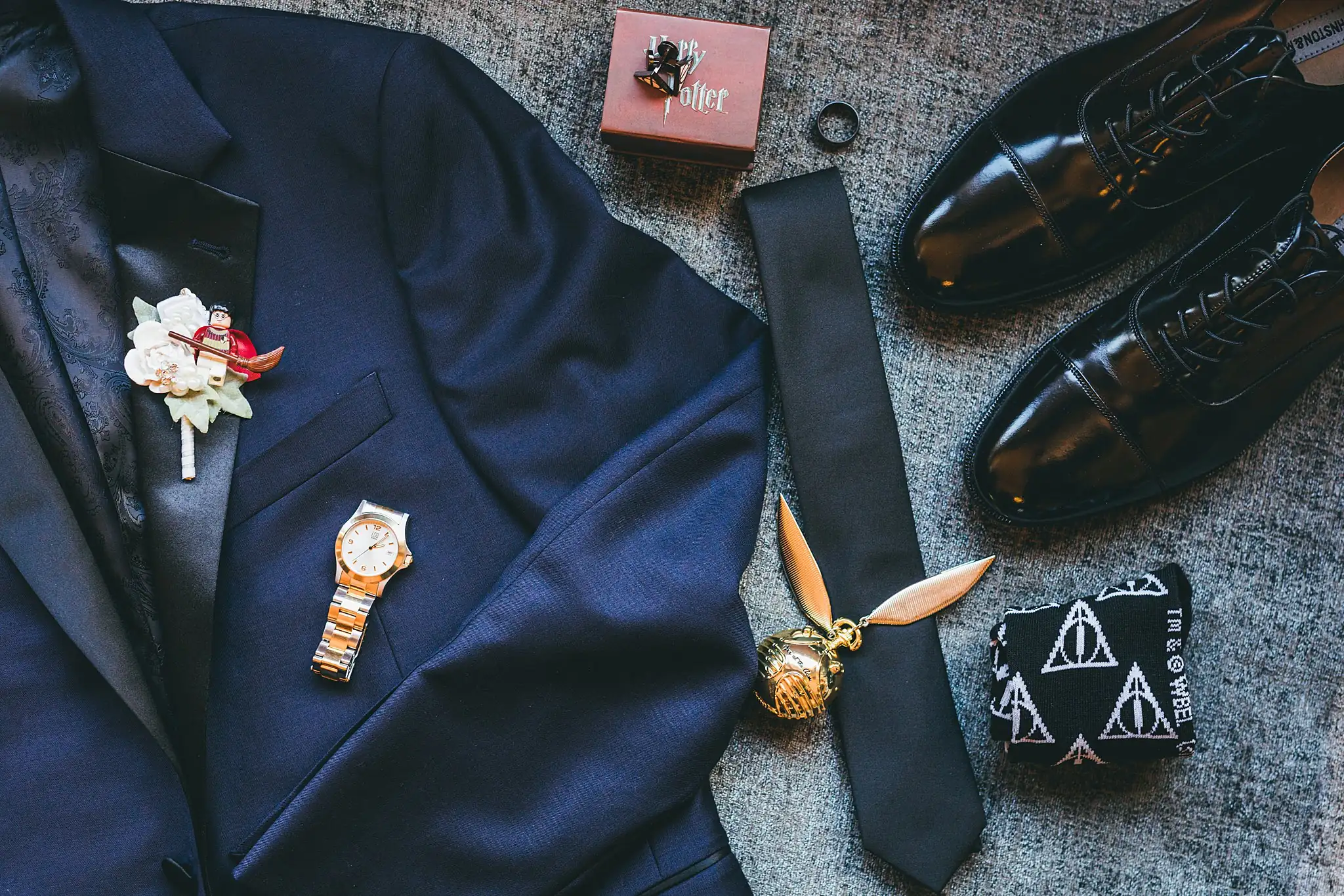 AtlantaWeddingPhotographers_1424.jpg Wedding Details: the groom's jacket and shoes with a golden snitch, at a wedding at Three Birches in Alpharetta, GA