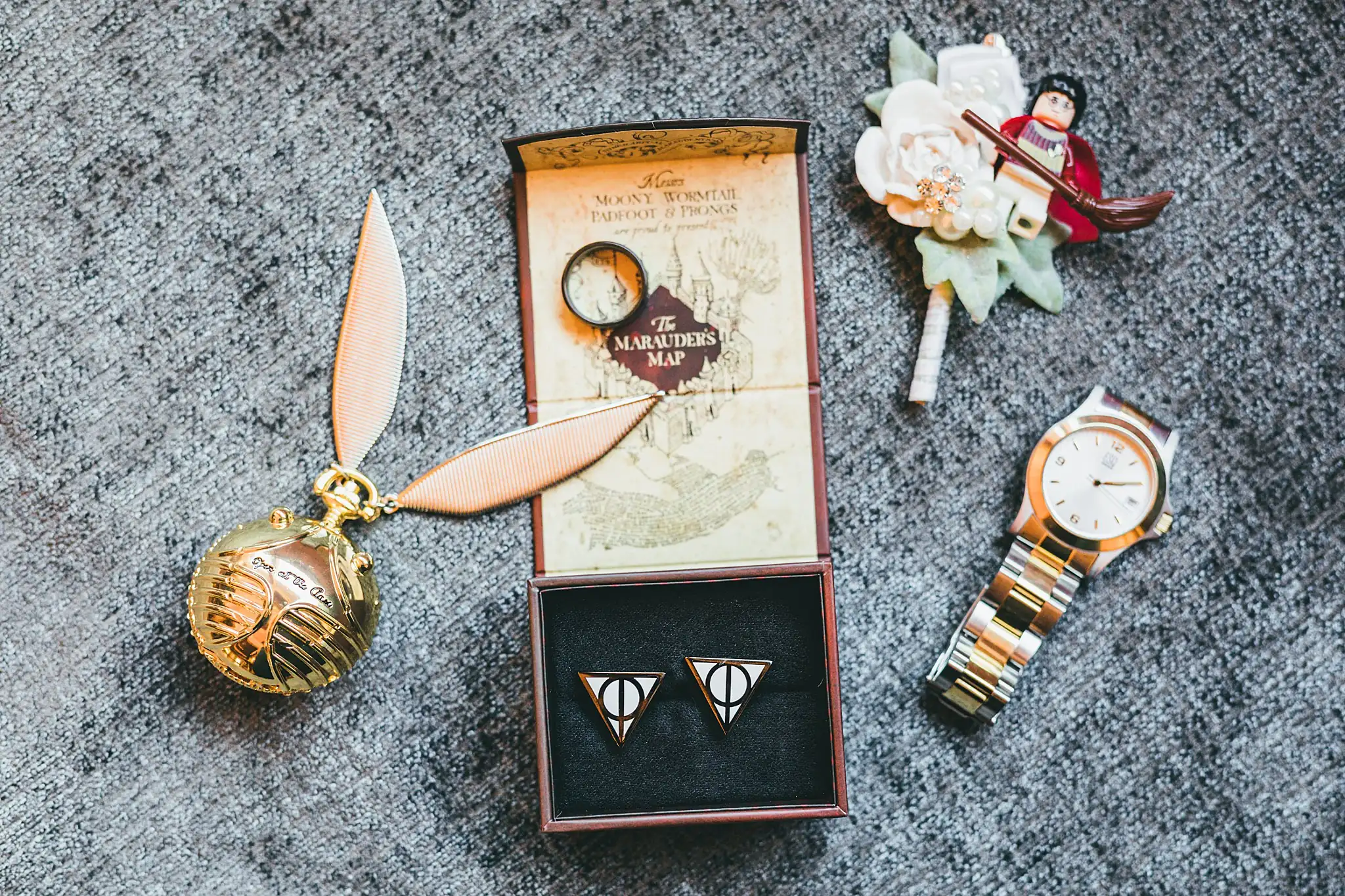 AtlantaWeddingPhotographers_1425.jpg Wedding Details: a golden snitch and the rings in a Marauder's Map box, at a wedding at Three Birches in Alpharetta, GA