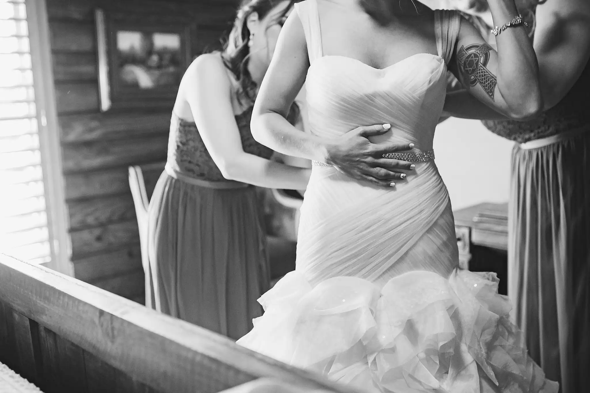 AtlantaWeddingPhotographers_1429.jpg Getting Ready: the bride being helped into her gown, before their wedding at Three Birches in Alpharetta, GA