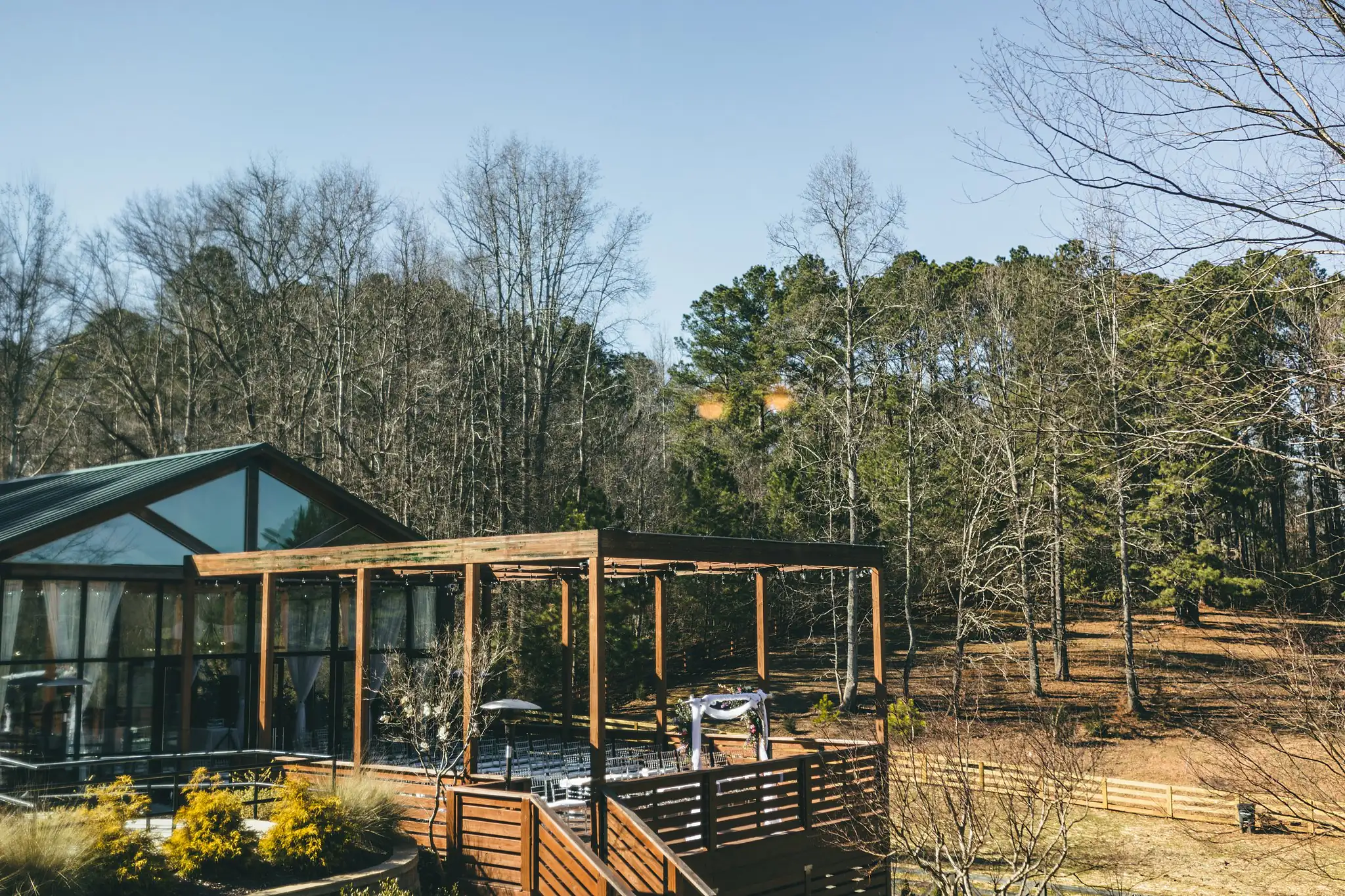 AtlantaWeddingPhotographers_1430.jpg Wedding Ceremony: the timber and glass lodge in the woods, at a wedding at Three Birches in Alpharetta, GA