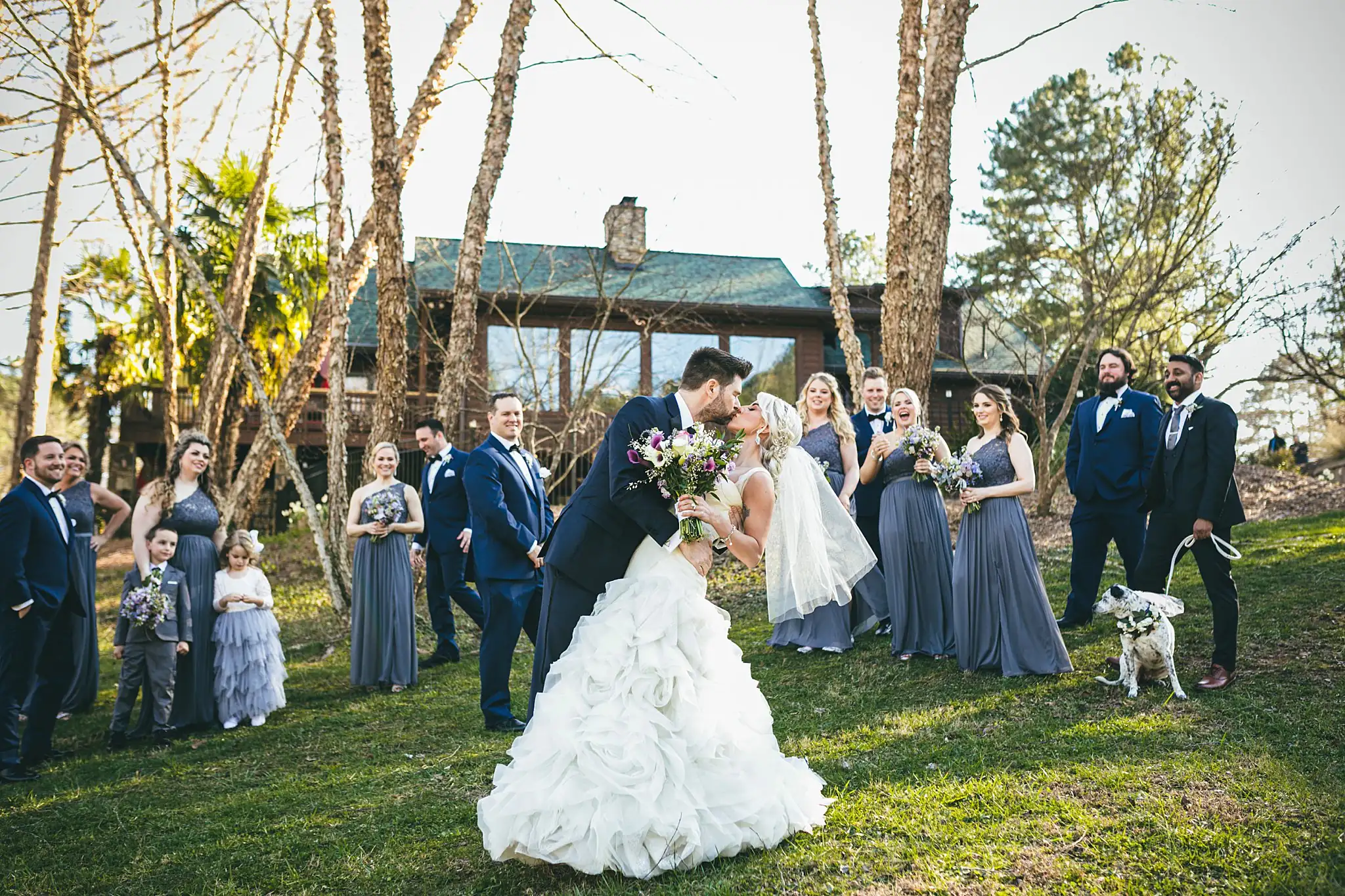 AtlantaWeddingPhotographers_1447.jpg Wedding Party: the couple kissing among the bridal party, at their wedding at Three Birches in Alpharetta, GA