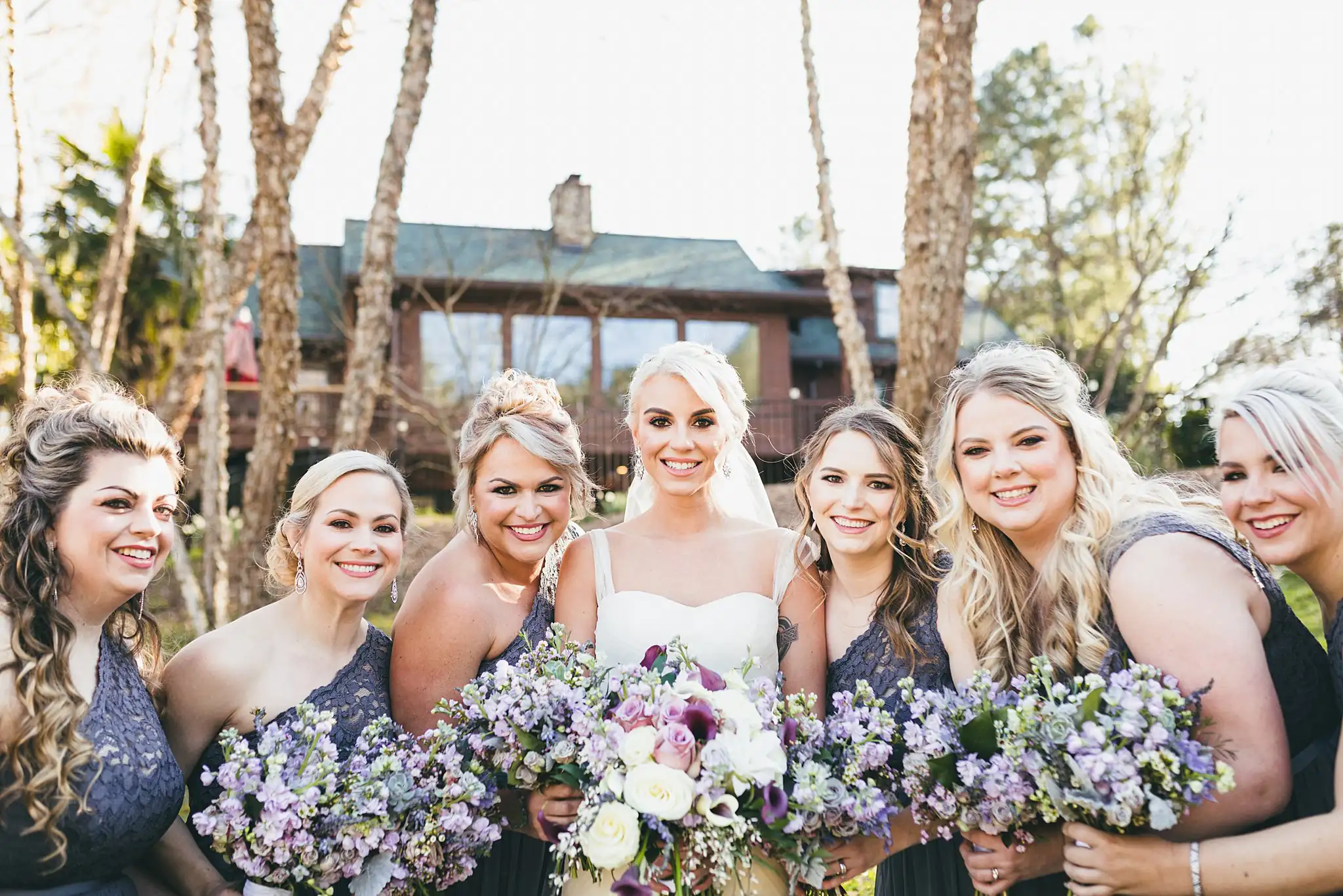AtlantaWeddingPhotographers_1449.jpg Wedding Party: the bridesmaids with their purple bouquets, at their wedding at Three Birches in Alpharetta, GA