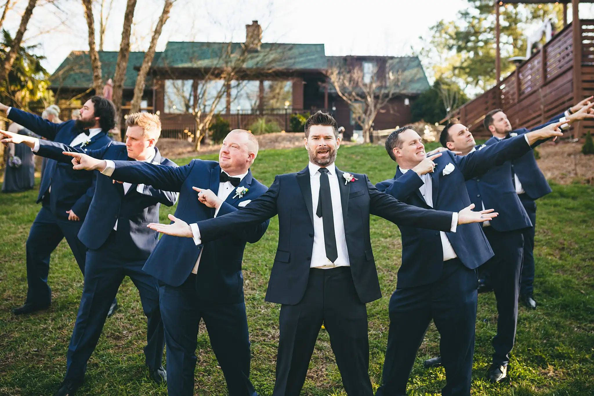 AtlantaWeddingPhotographers_1451.jpg Wedding Party: the groomsmen clowning with arms outstretched, at their wedding at Three Birches in Alpharetta, GA