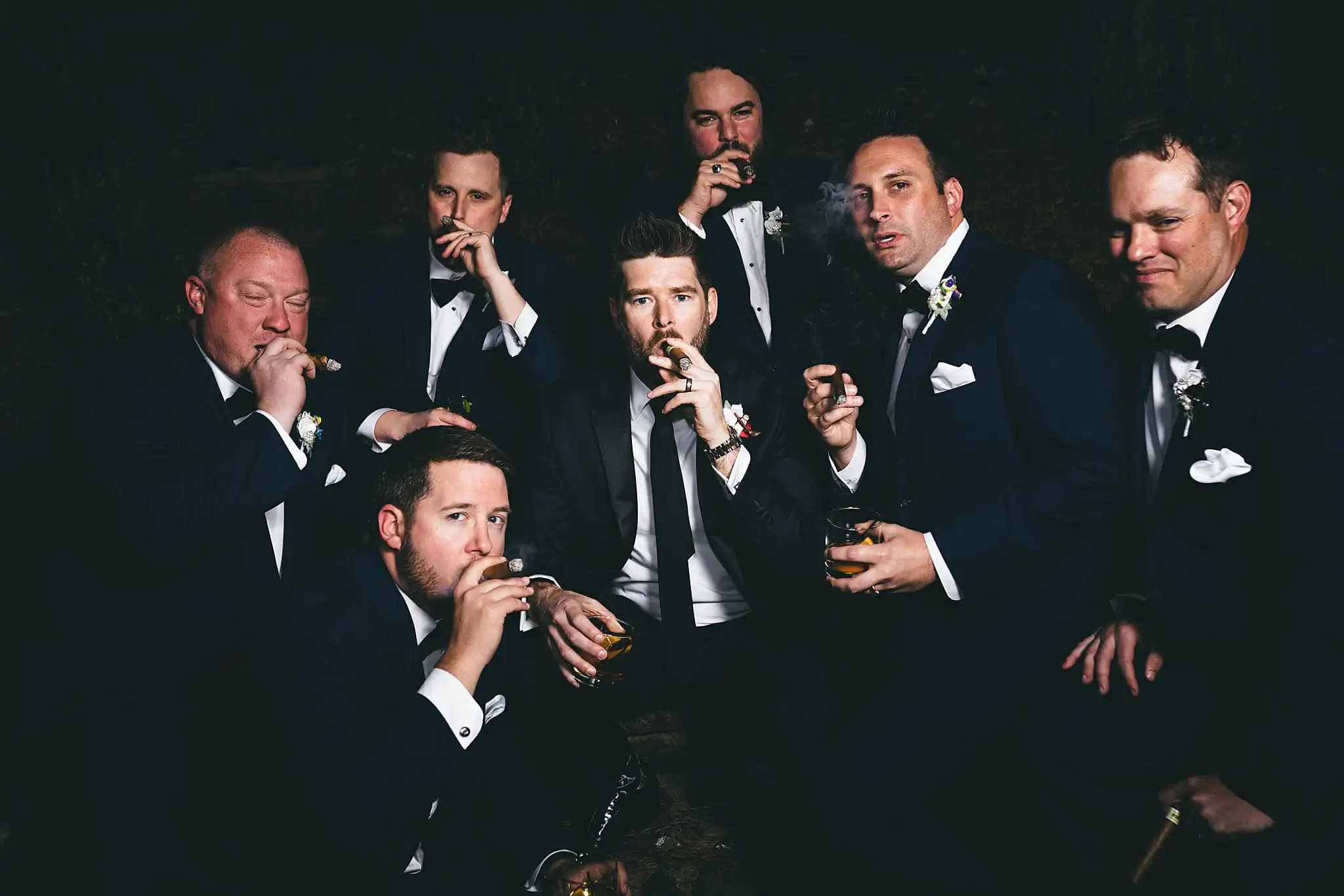 AtlantaWeddingPhotographers_1461.jpg Wedding Party: the groomsmen with cigars in the dark, at their wedding at Three Birches in Alpharetta, GA