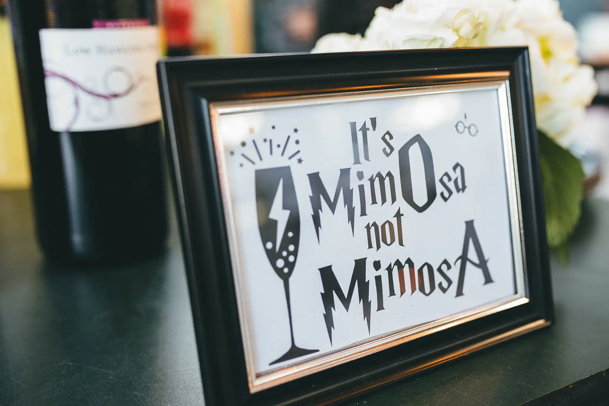 AtlantaWeddingPhotographers_1468.jpg Reception Details: a framed sign reading It's MimOsa not MimosA, at their wedding at Three Birches in Alpharetta, GA