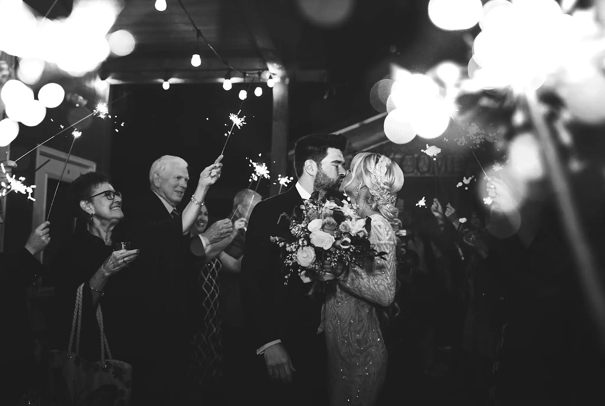 AtlantaWeddingPhotographers_1486.jpg Sparkler Exit: the couple leaving through the sparklers, at their wedding at Three Birches in Alpharetta, GA