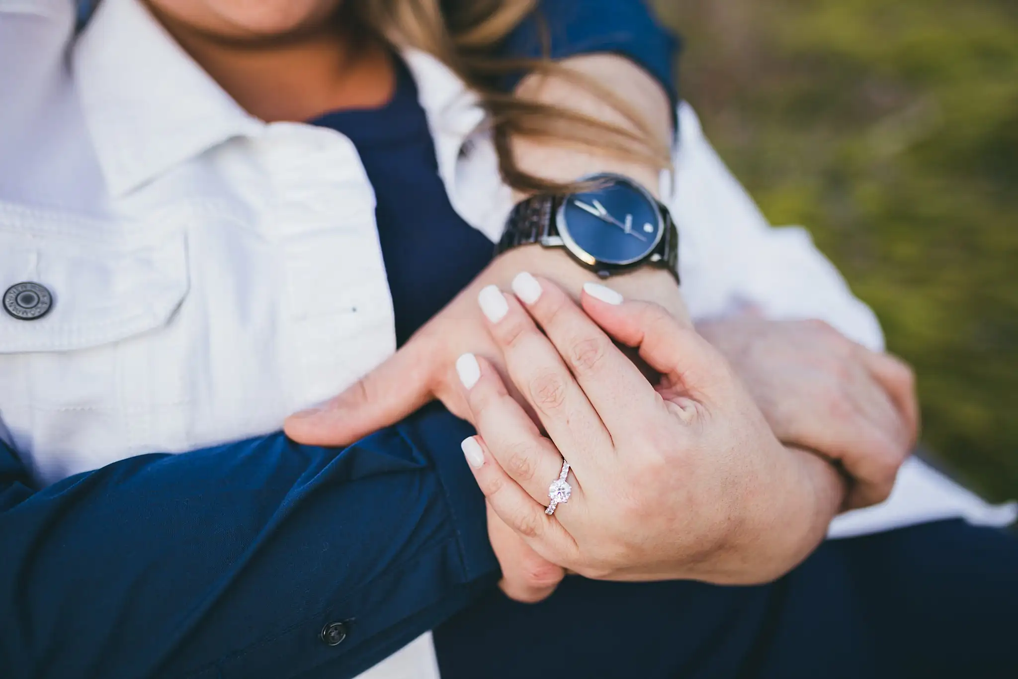 Engagement Portraits: her engagement ring against his sleeve, during their engagement session at Kennesaw Mountain in Kennesaw, GA