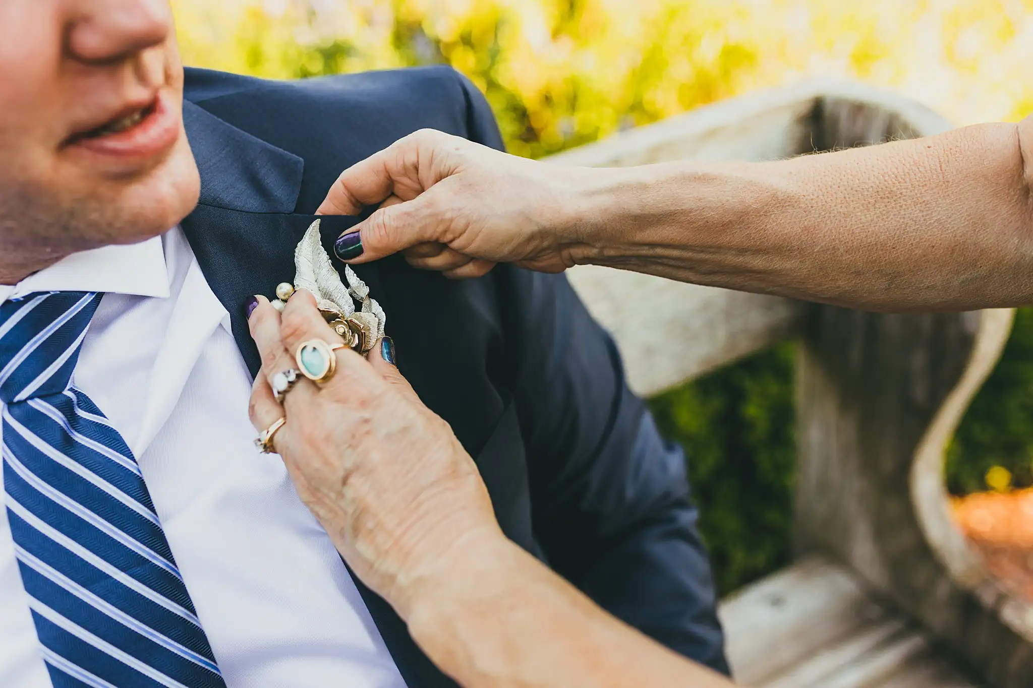 AtlantaWeddingPhotographers_1554.jpg Getting Ready: the groom's boutonniere being pinned on, before their micro wedding at Barrington Hall in Roswell, GA