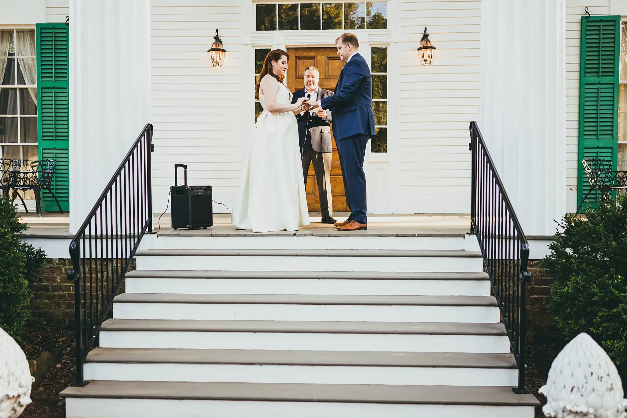 AtlantaWeddingPhotographers_1567.jpg Wedding Ceremony: the ceremony from the foot of the stone staircase, at their micro ceremony at Barrington Hall in Roswell, GA