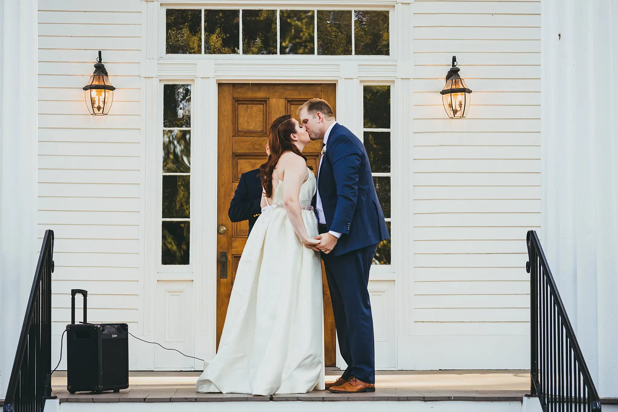 AtlantaWeddingPhotographers_1568.jpg Wedding Ceremony: the first kiss in the doorway of the house, at their micro ceremony at Barrington Hall in Roswell, GA