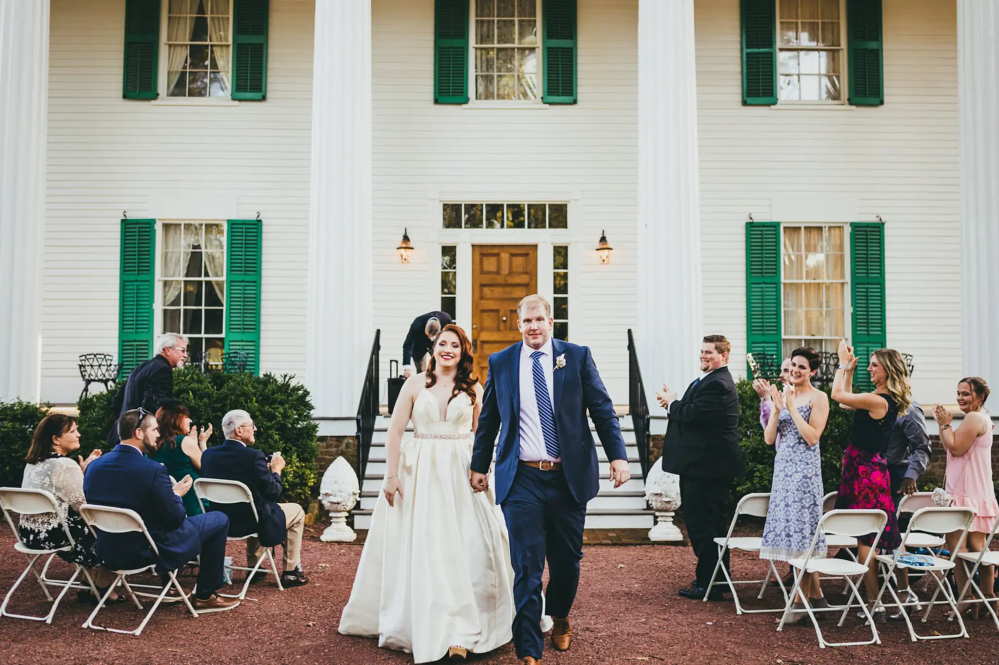 AtlantaWeddingPhotographers_1570.jpg Recessional: the couple walking out through the applause, at their micro ceremony at Barrington Hall in Roswell, GA