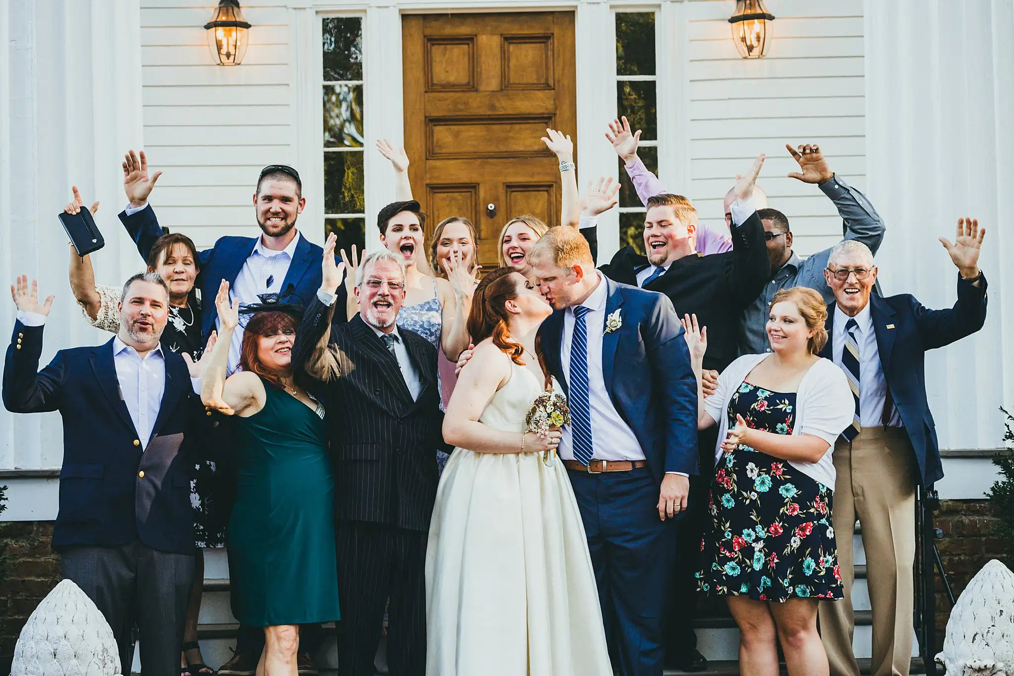 AtlantaWeddingPhotographers_1571.jpg Wedding Party: everyone with their hands in the air on the steps, at their tiny wedding at Barrington Hall in Roswell, GA