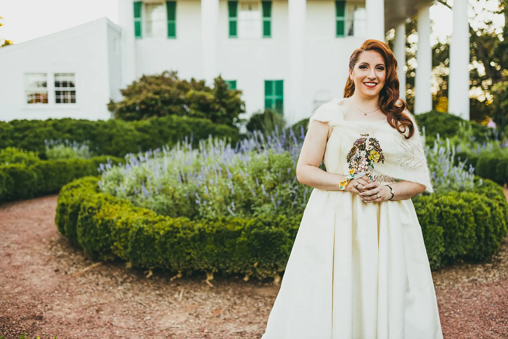 AtlantaWeddingPhotographers_1579.jpg Bridal Portraits: the bride with her brooch bouquet in the lavender garden, at their micro wedding at Barrington Hall in Roswell, GA