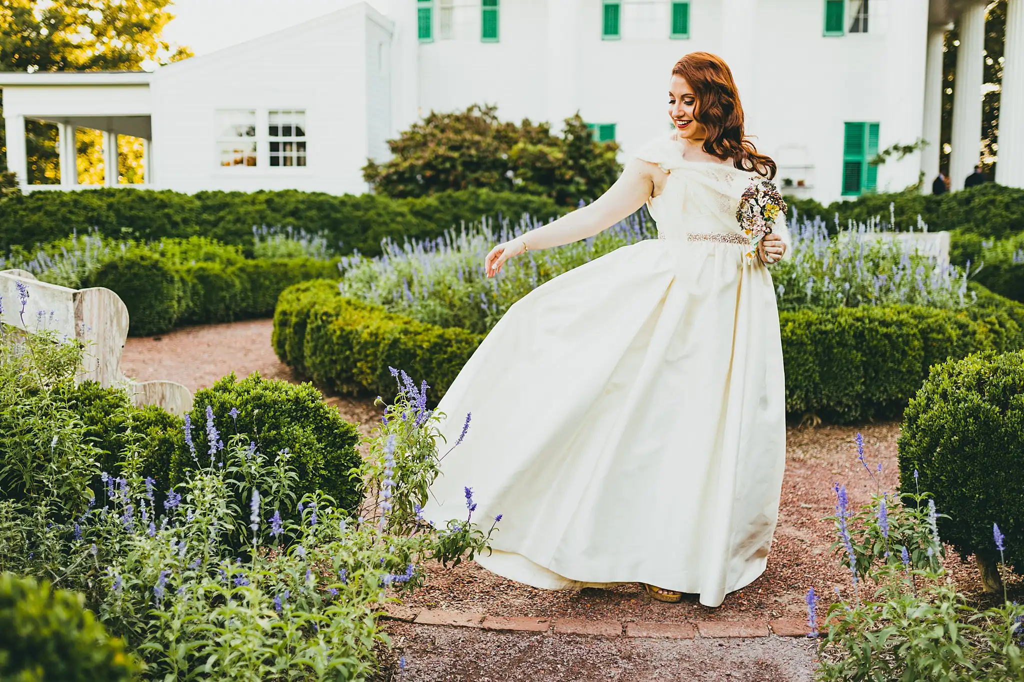 AtlantaWeddingPhotographers_1580.jpg Bridal Portraits: the bride turning her skirt out on the garden path, at their intimate wedding at Barrington Hall in Roswell, GA
