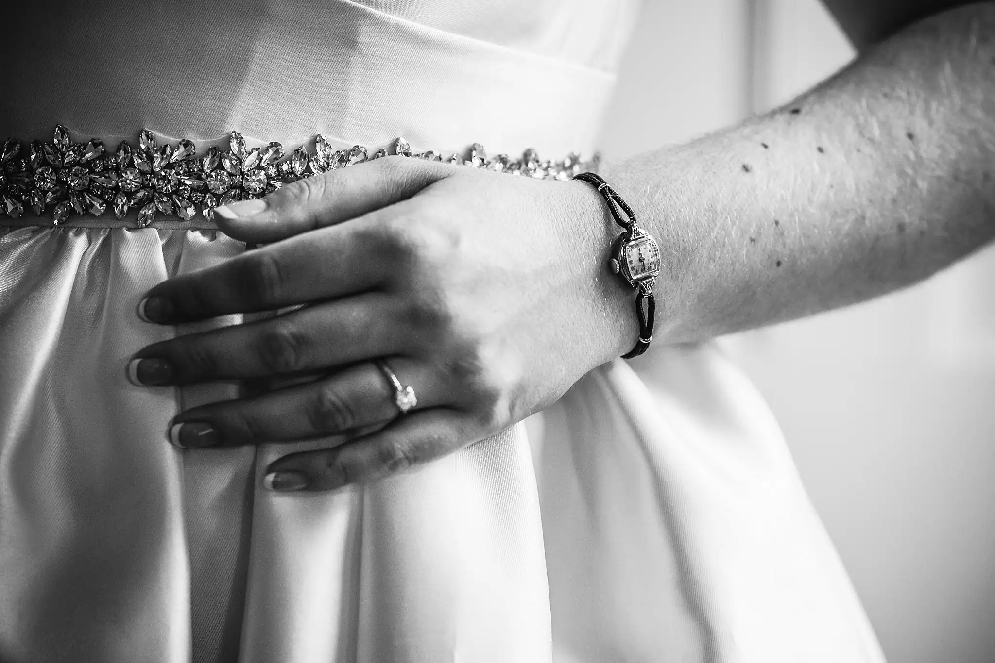 AtlantaWeddingPhotographers_1582.jpg Wedding Details: her hand on the gown, ring and bracelet, in black and white, at their micro wedding at Barrington Hall in Roswell, GA