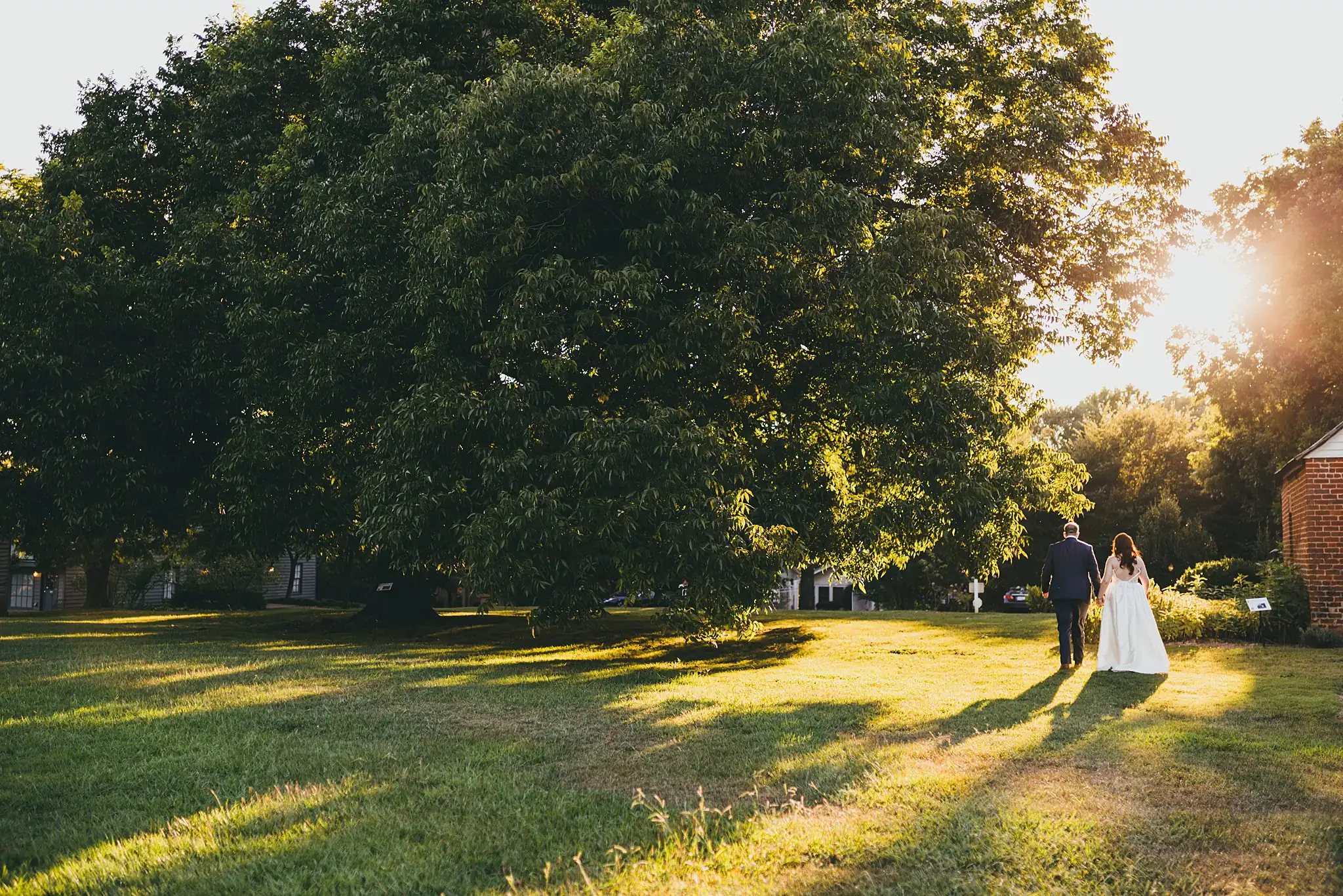 AtlantaWeddingPhotographers_1583.jpg Wedding Formals: the couple small under the oaks at golden hour, at their elopement at Barrington Hall in Roswell, GA