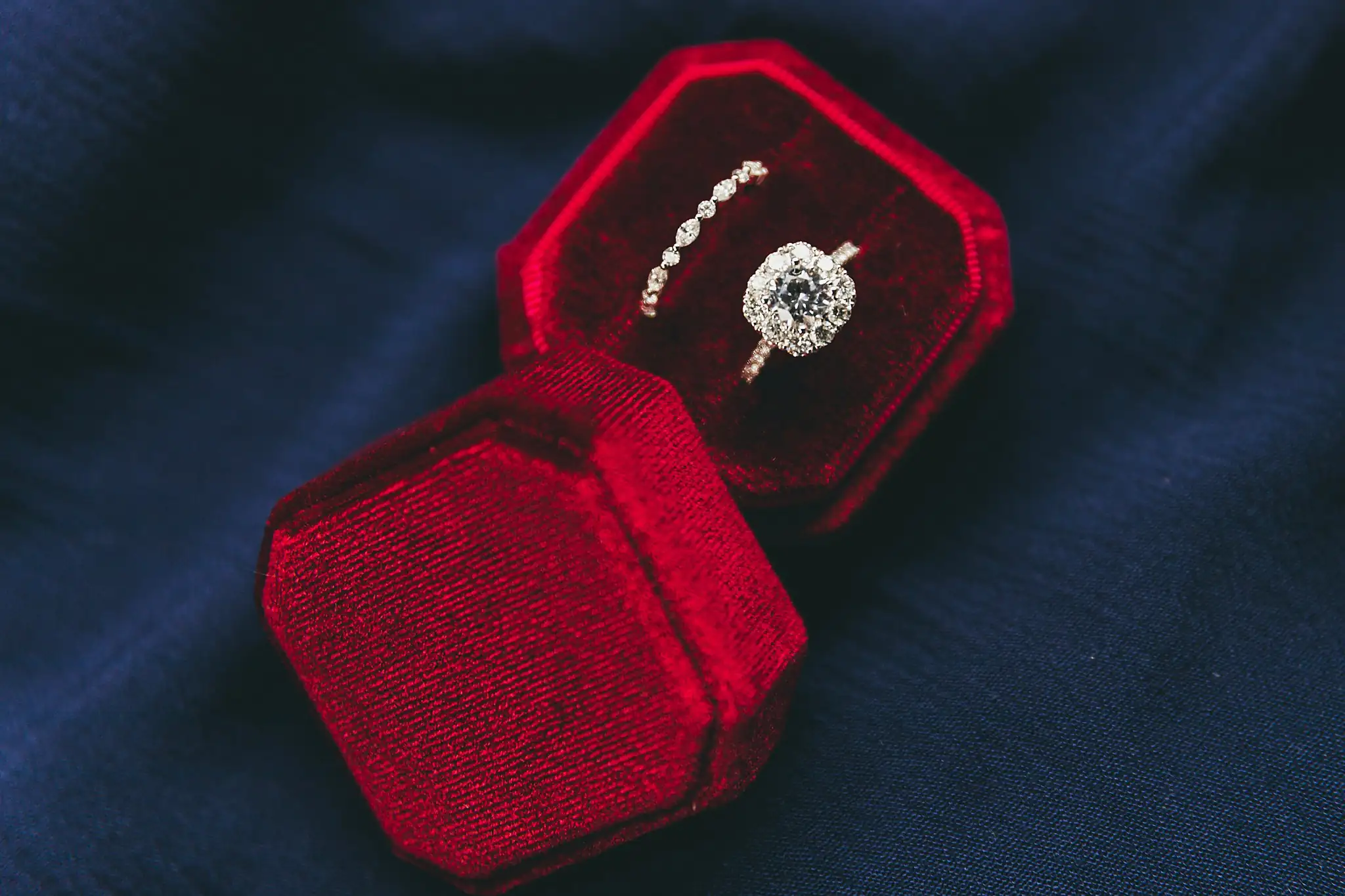 Styled Shoot Hollywood Regency Wedding Inspiration Atlanta Photographers Wedding Details: the engagement ring and band in a red velvet box, at a Hollywood Regency Wedding styled shoot at the Foxglove in Marietta, GA