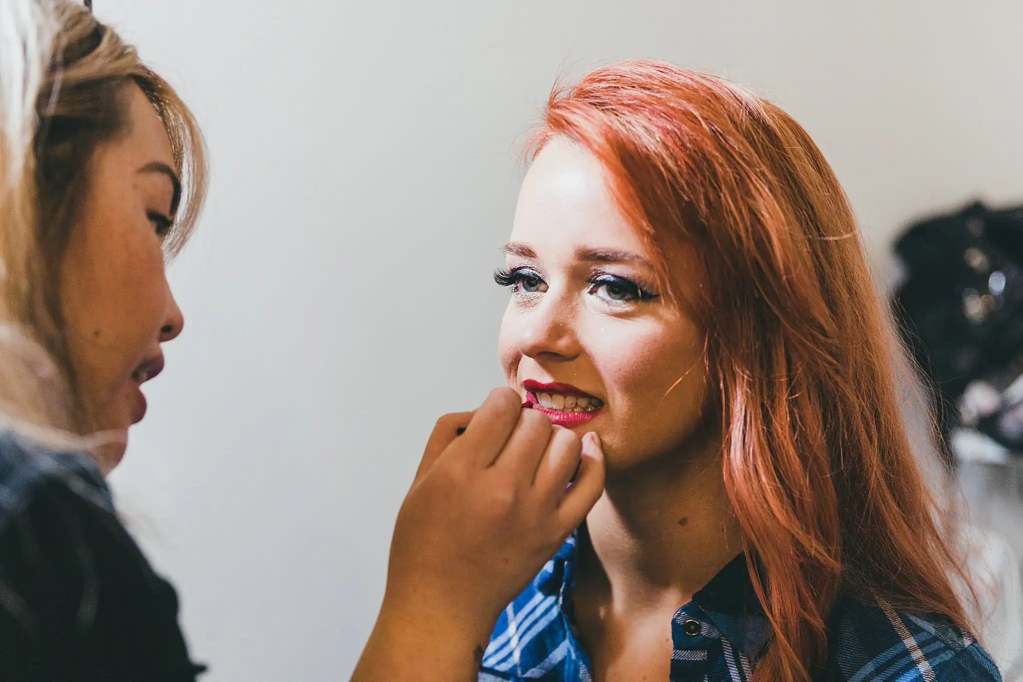 Styled Shoot Hollywood Regency Wedding Inspiration Atlanta Photographers Getting Ready: a makeup artist painting the bride's red lip, at a Hollywood Regency Wedding styled shoot at the Foxglove in Marietta, GA