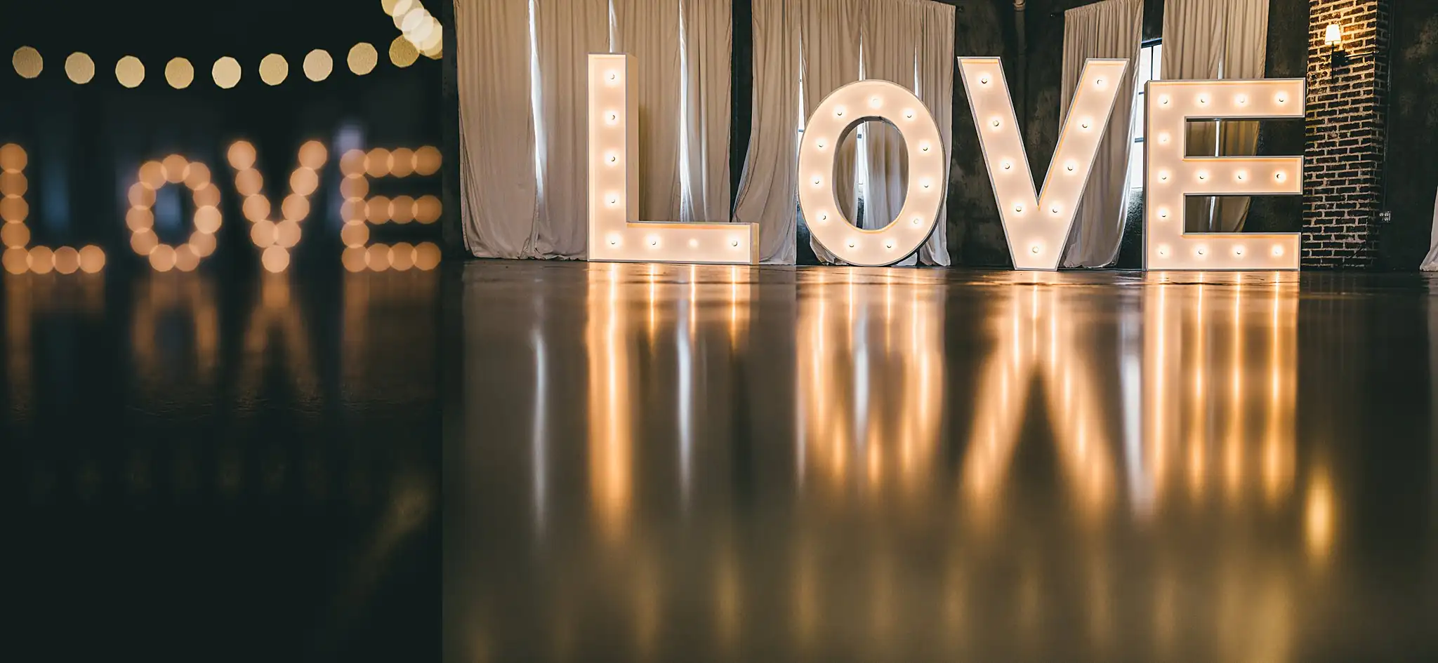 Styled Shoot Hollywood Regency Wedding Inspiration Atlanta Photographers Reception Details: the lit LOVE letters reflected in the floor, at a Hollywood Regency Wedding styled shoot at the Foxglove in Marietta, GA