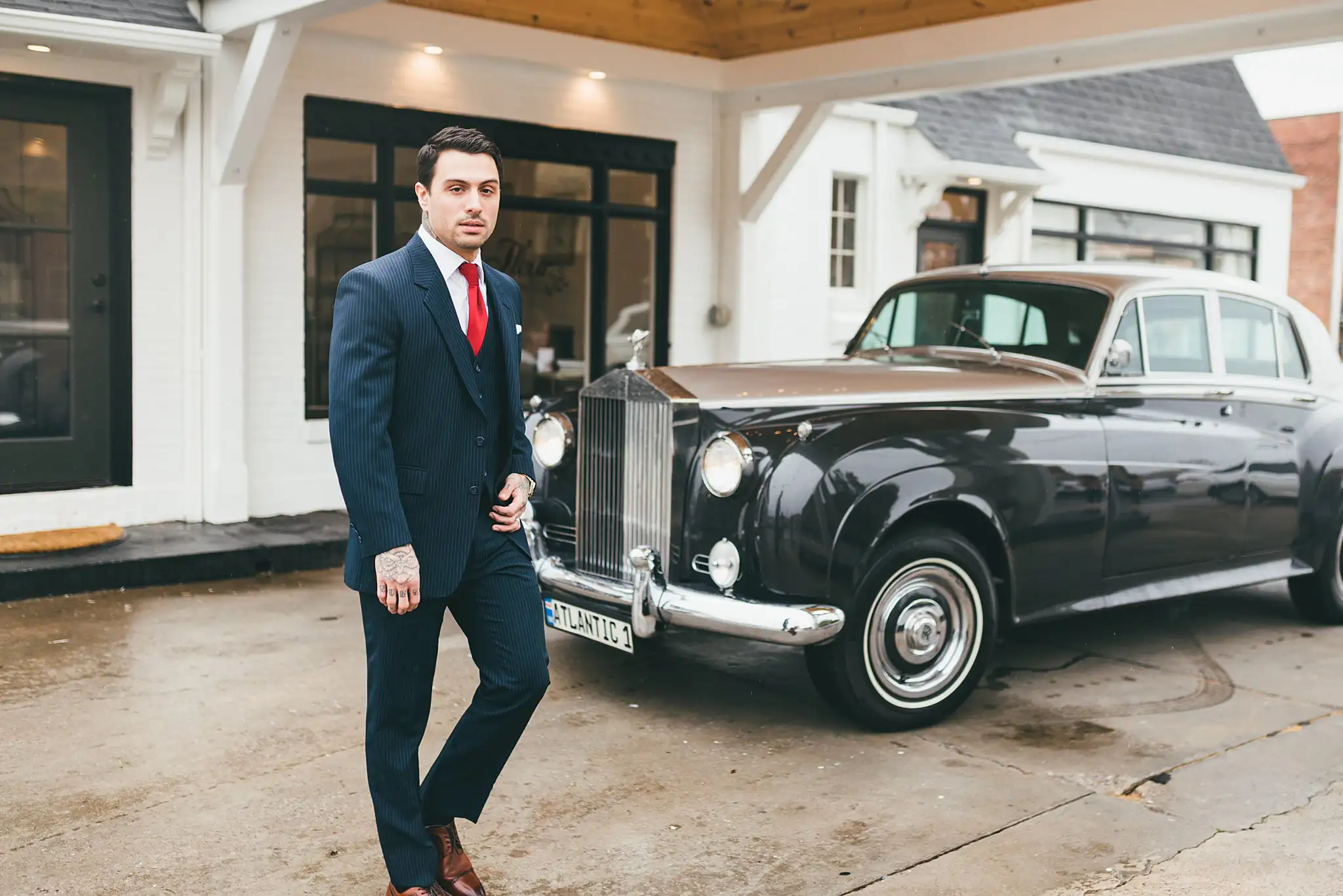 Styled Shoot Hollywood Regency Wedding Inspiration Atlanta Photographers Wedding Formals: the groom walking past the vintage Rolls-Royce, at a Hollywood Regency Wedding styled shoot at the Foxglove in Marietta, GA