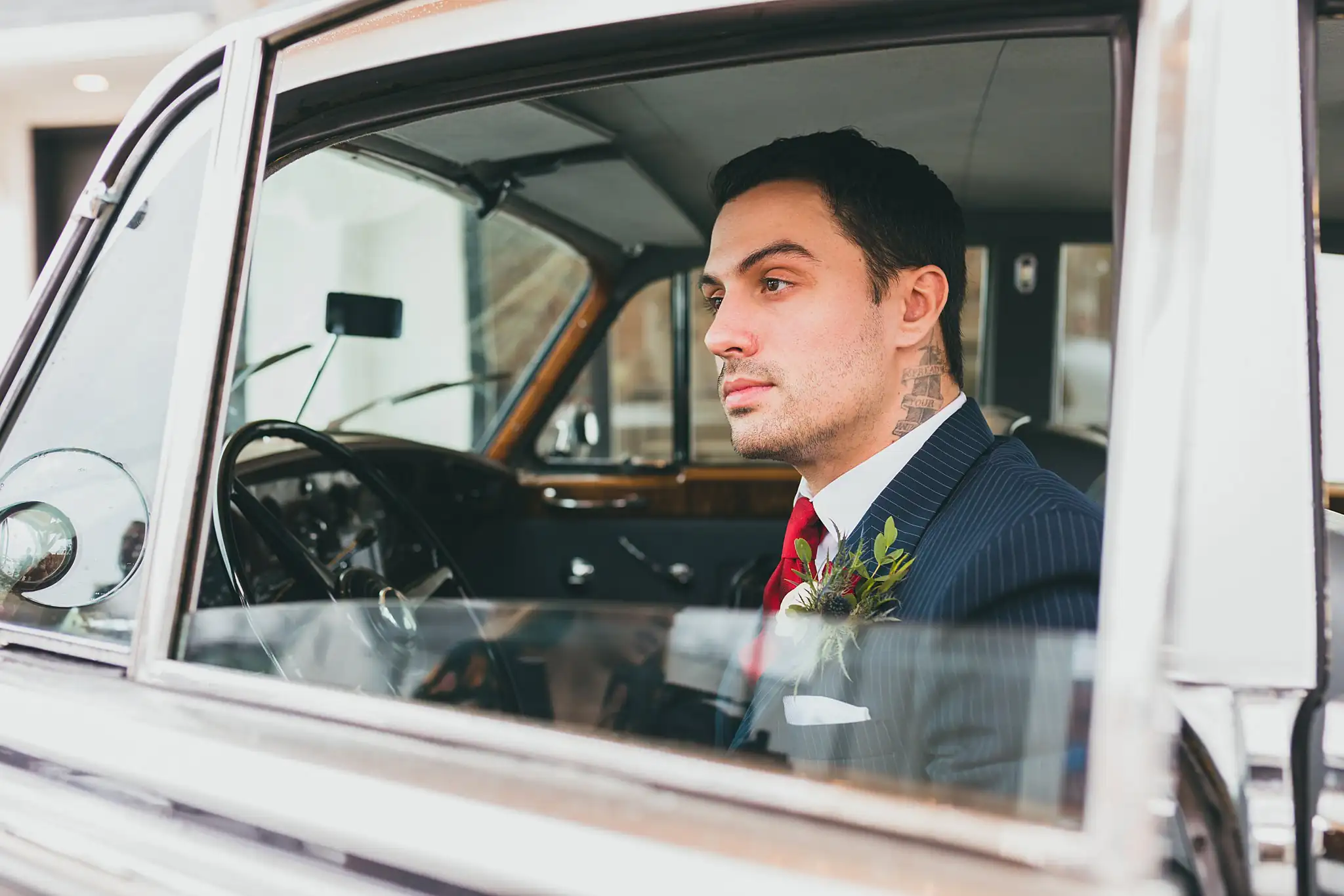 Styled Shoot Hollywood Regency Wedding Inspiration Atlanta Photographers Wedding Formals: the groom at the wheel of the vintage Rolls-Royce, at a Hollywood Regency Wedding styled shoot at the Foxglove in Marietta, GA