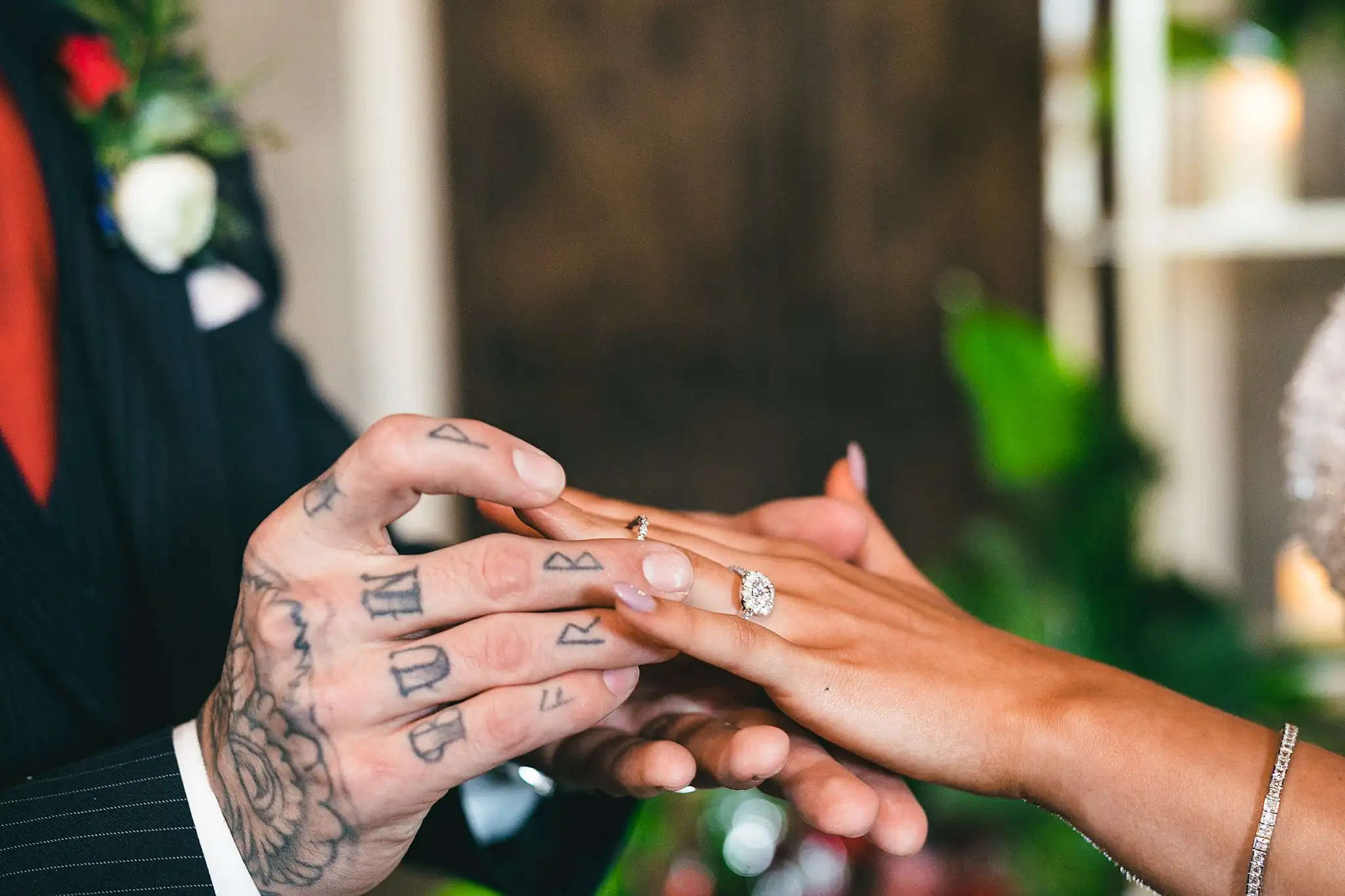 Styled Shoot Hollywood Regency Wedding Inspiration Atlanta Photographers Wedding Ceremony: the groom sliding the ring onto her finger, at a Hollywood Regency Wedding styled shoot at the Foxglove in Marietta, GA