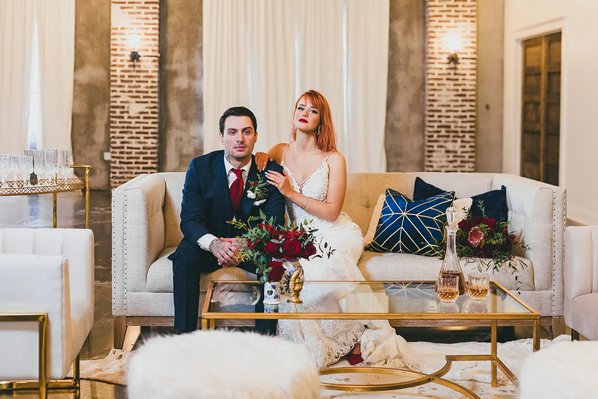 Styled Shoot Hollywood Regency Wedding Inspiration Atlanta Photographers Wedding Formals: the couple side by side on the cream sofa, at a Hollywood Regency Wedding styled shoot at the Foxglove in Marietta, GA