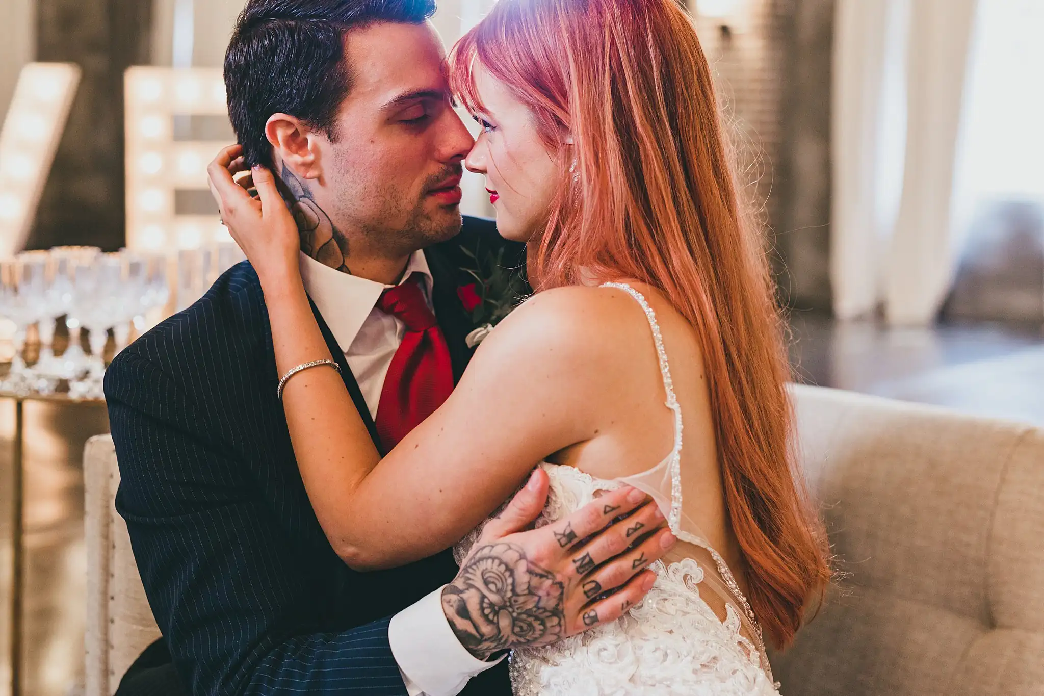 Styled Shoot Hollywood Regency Wedding Inspiration Atlanta Photographers Wedding Formals: the couple close together on a velvet sofa, at a Hollywood Regency Wedding styled shoot at the Foxglove in Marietta, GA