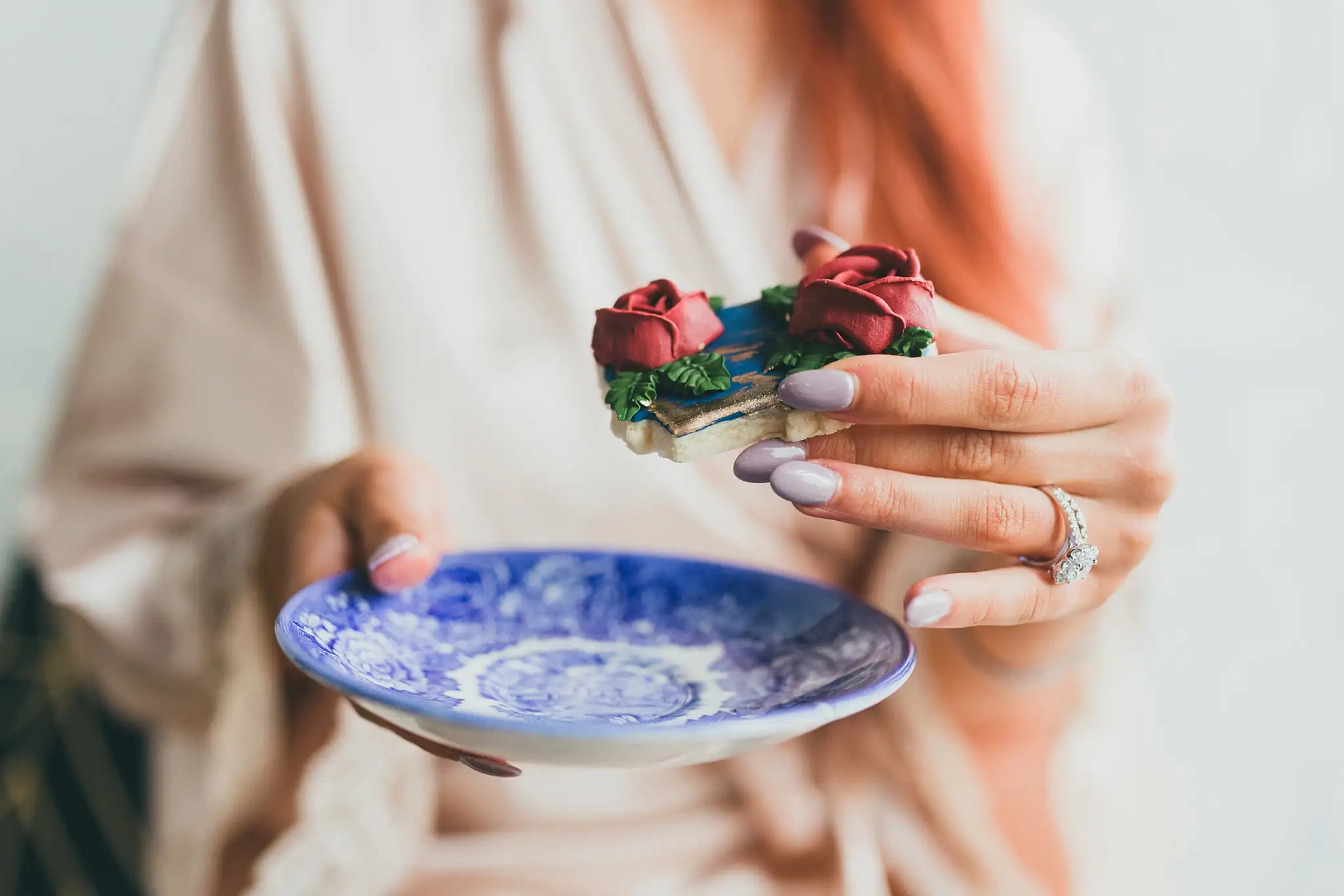 Styled Shoot Hollywood Regency Wedding Inspiration Atlanta Photographers Getting Ready: the bride's hands holding a blue-and-white saucer, at a Hollywood Regency Wedding styled shoot at the Foxglove in Marietta, GA