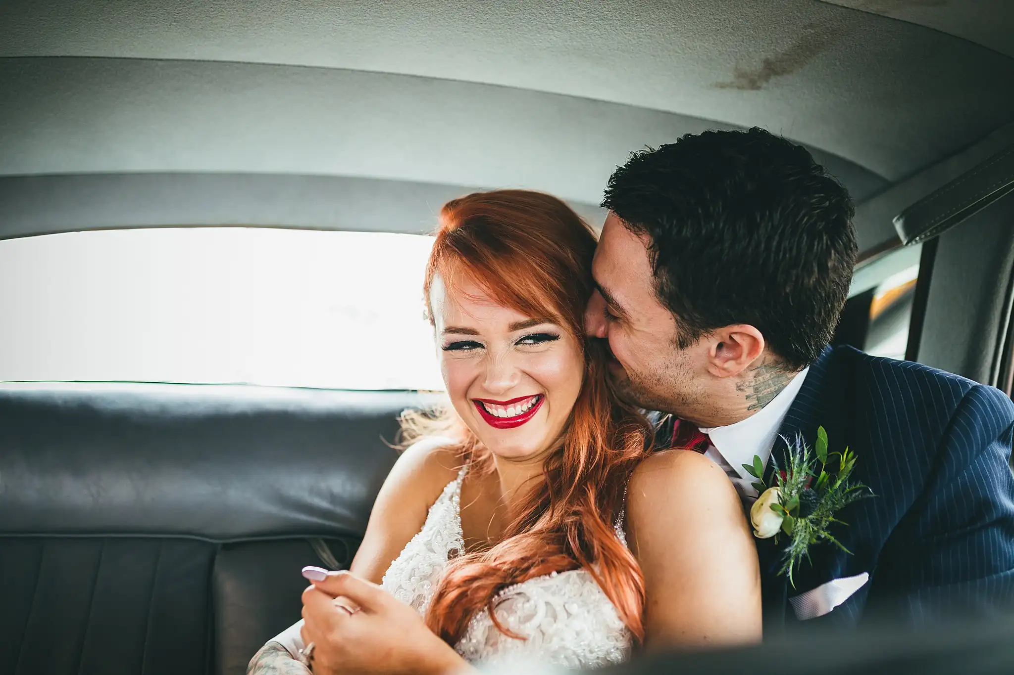 Styled Shoot Hollywood Regency Wedding Inspiration Atlanta Photographers Wedding Formals: the groom kissing the bride's cheek in the car, at a Hollywood Regency Wedding styled shoot at the Foxglove in Marietta, GA