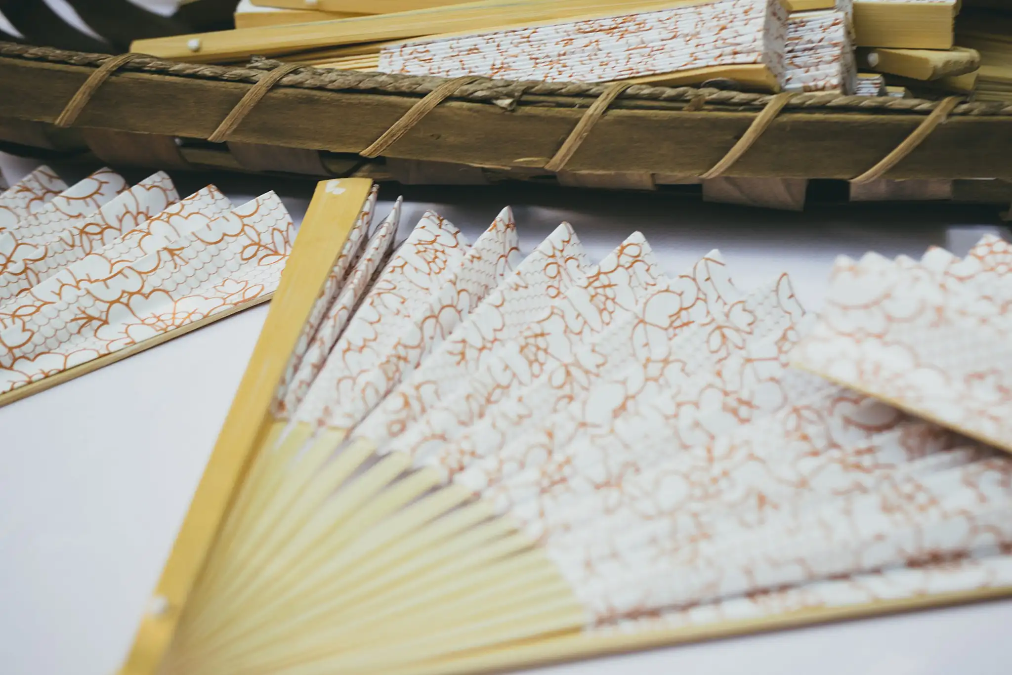 Wedding Details: printed paper fans laid out for the guests, at a wedding at the Atlanta Botanical Garden in Atlanta, GA