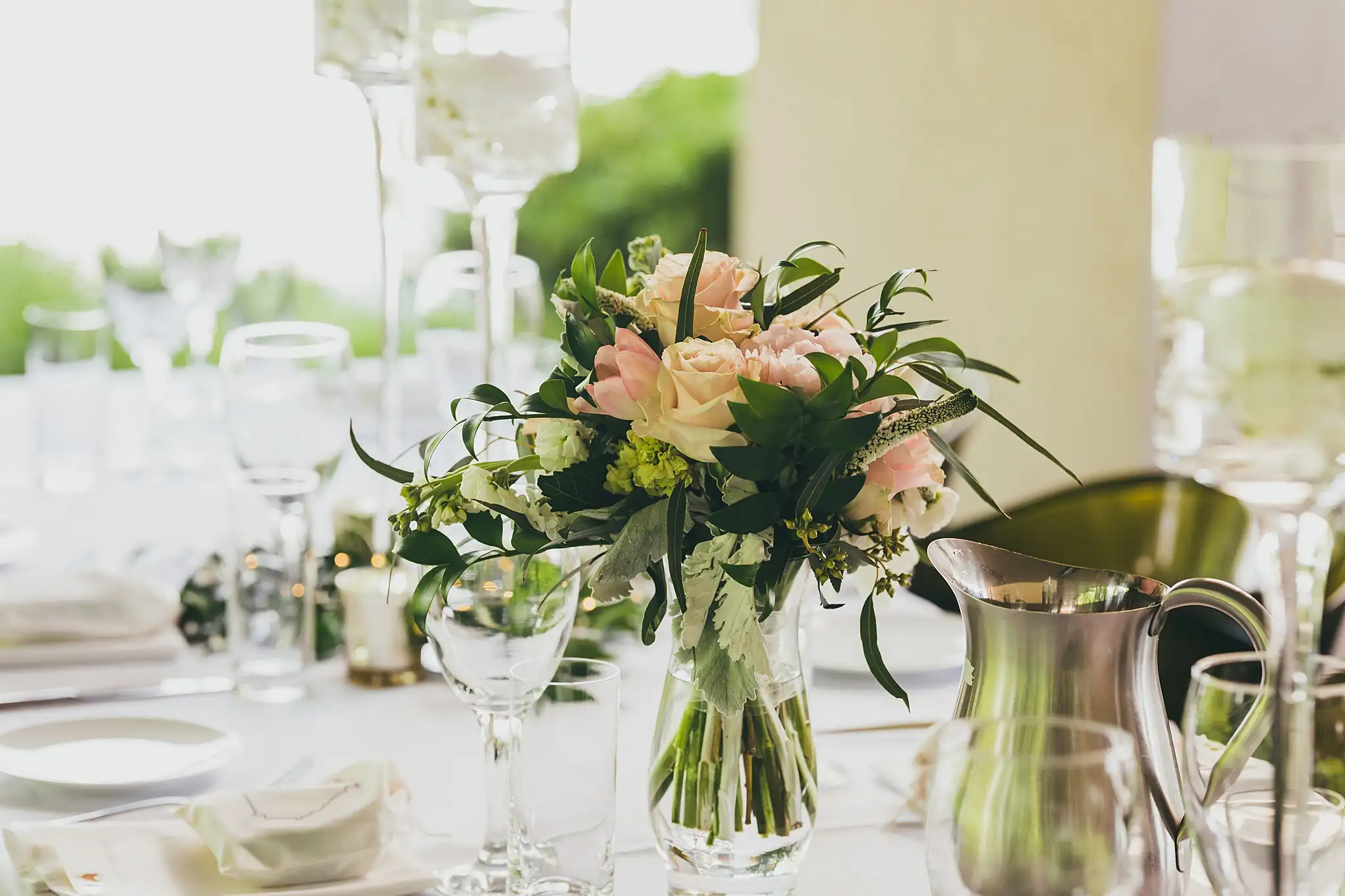 Wedding Florals: a low blush arrangement on the table, at their wedding at the Atlanta Botanical Garden in Atlanta, GA