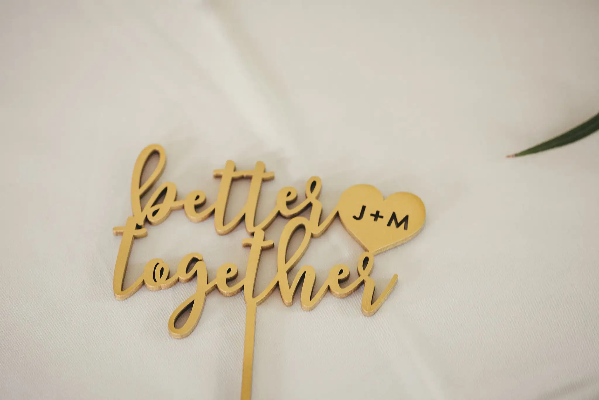 Wedding Cake Details: a gold better together cake topper, at their wedding at the Atlanta Botanical Garden in Atlanta, GA