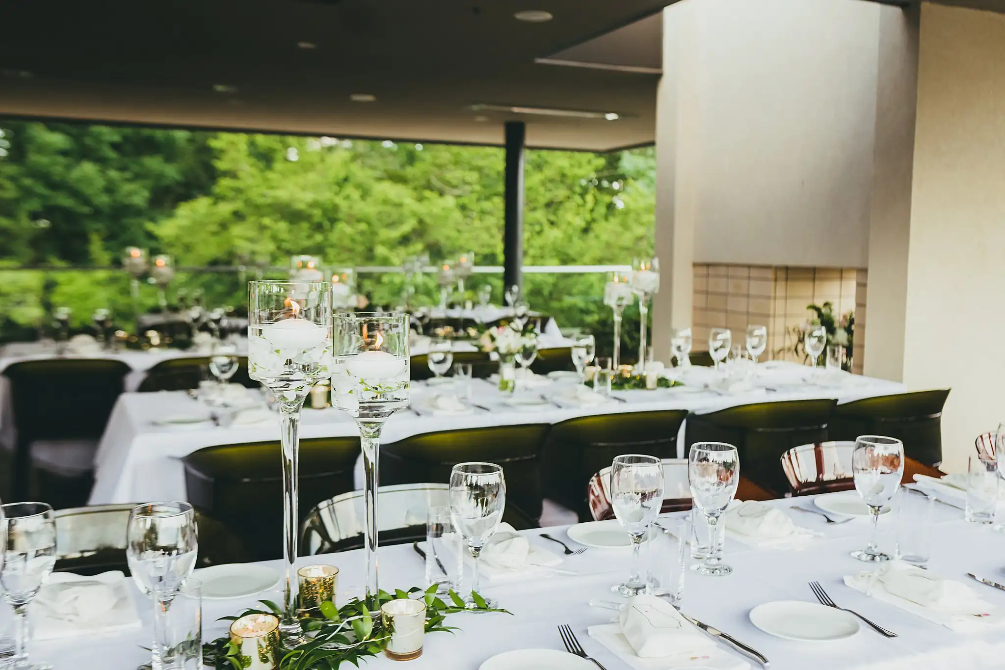 Reception Details: the tables set beneath the pavilion, at their wedding at the Atlanta Botanical Garden in Atlanta, GA