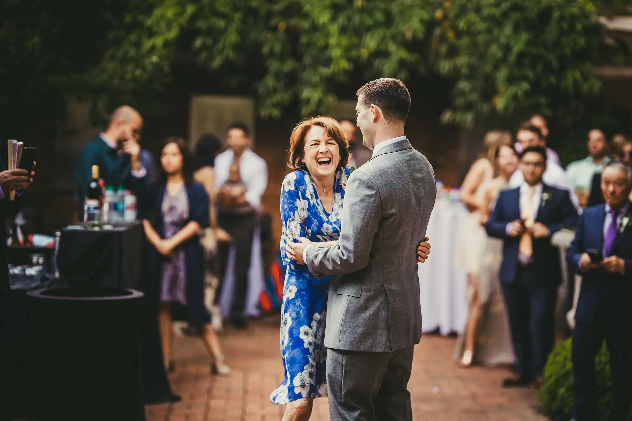 Parent Dance: the groom dancing with his mother, at their wedding at the Atlanta Botanical Garden in Atlanta, GA