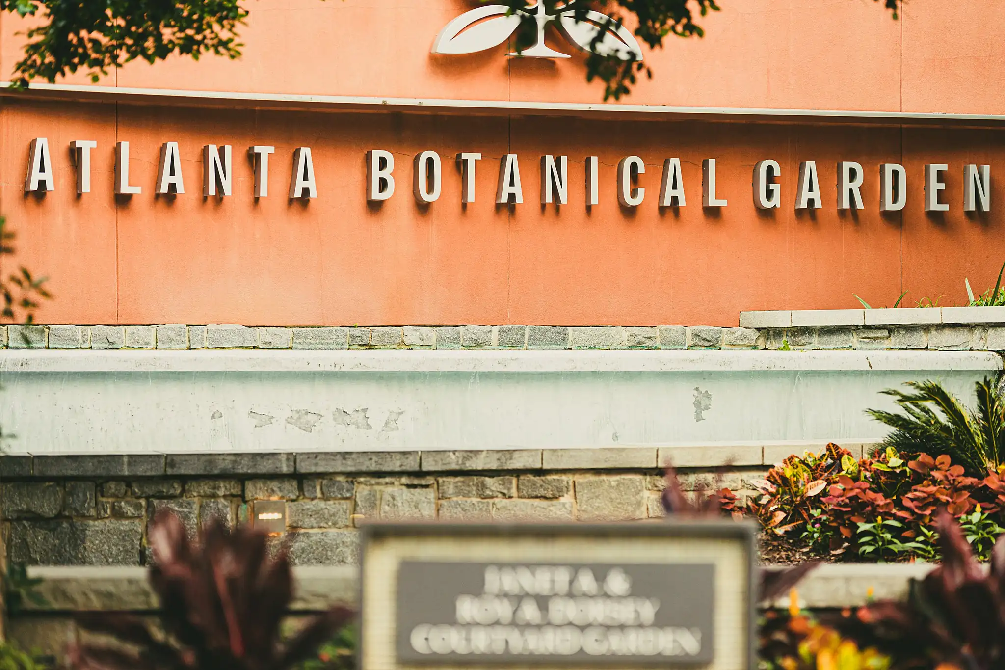 Wedding Ceremony: the garden's entrance sign, at a wedding at the Atlanta Botanical Garden in Atlanta, GA