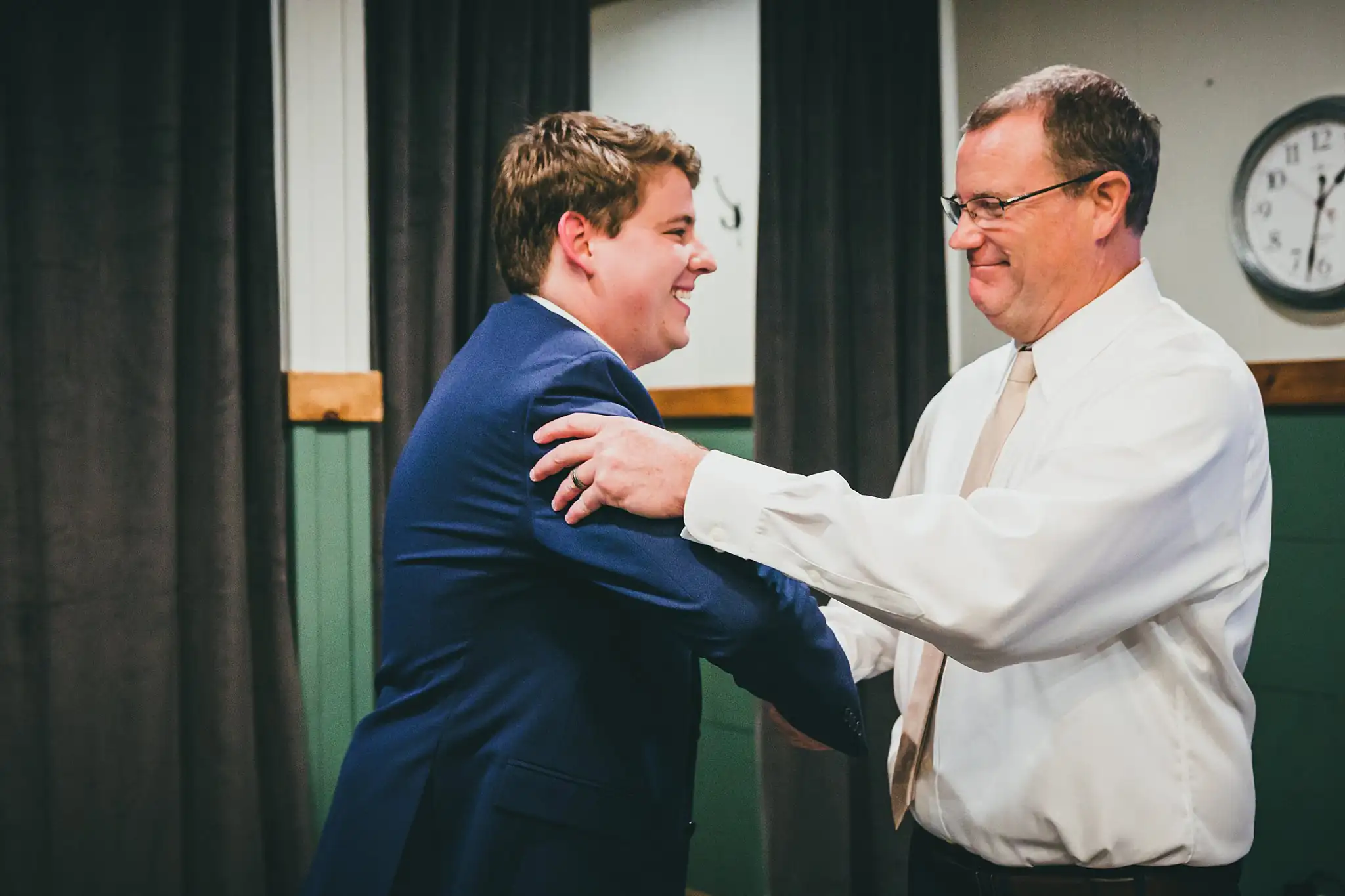 Barn at Harper Pines Wedding Thomaston, GA Atlanta Wedding Photographers Getting Ready: the groom hugging his father, before their wedding at the Barn at Harper Pines in Thomaston, GA